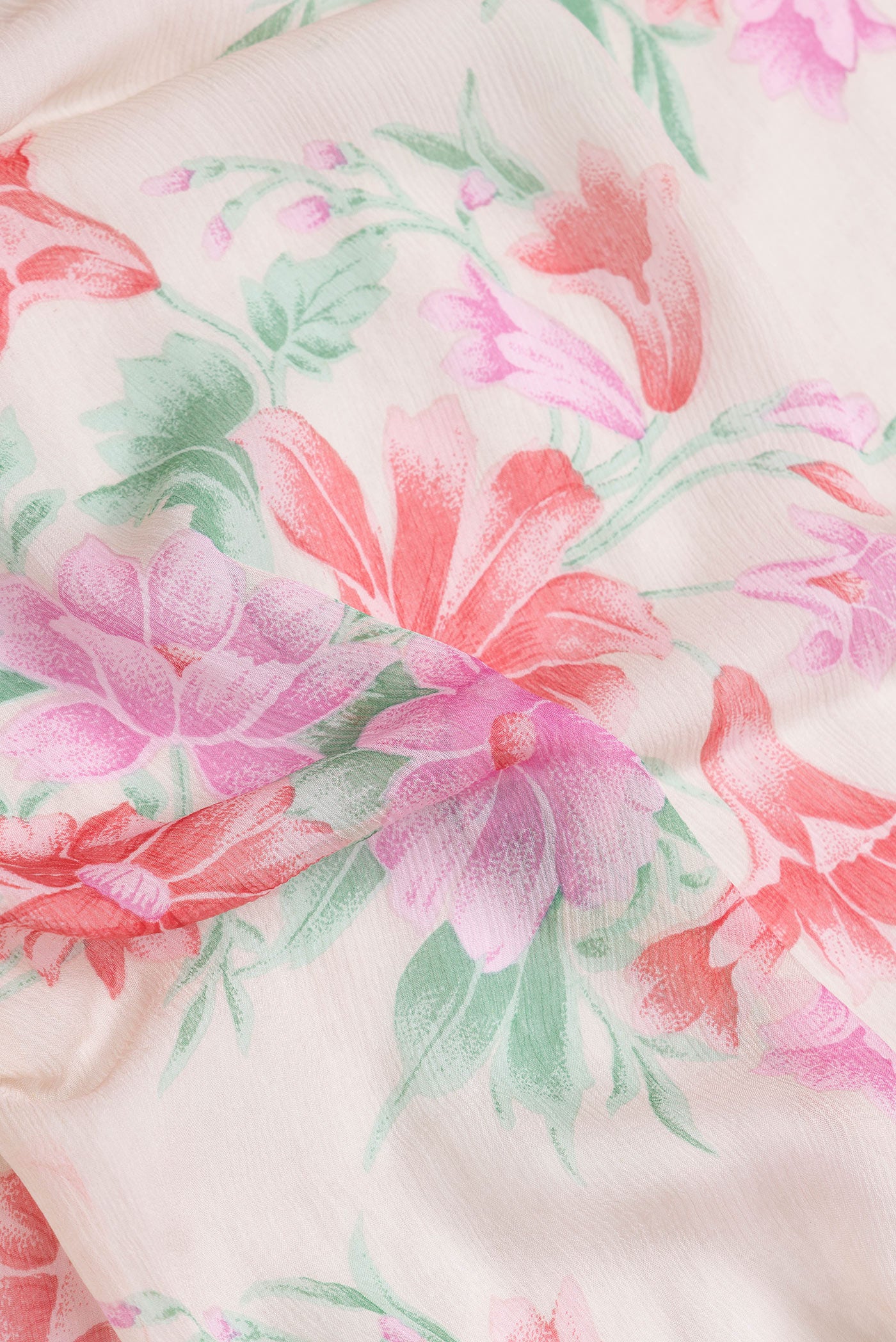 Close up of Beige Dual Tone Mysore Chiffon Saree with Printed design on the body and Plain Border.  displaying folds