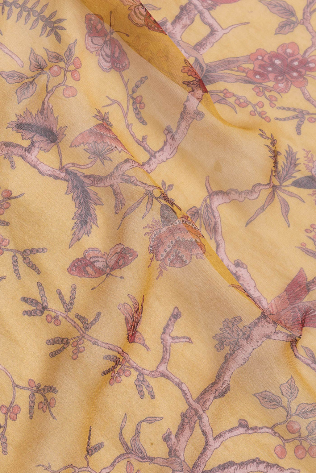 Close up of Mustard Dual Tone Mysore Chiffon Saree with Printed design on the body and Zari Border.  displaying folds