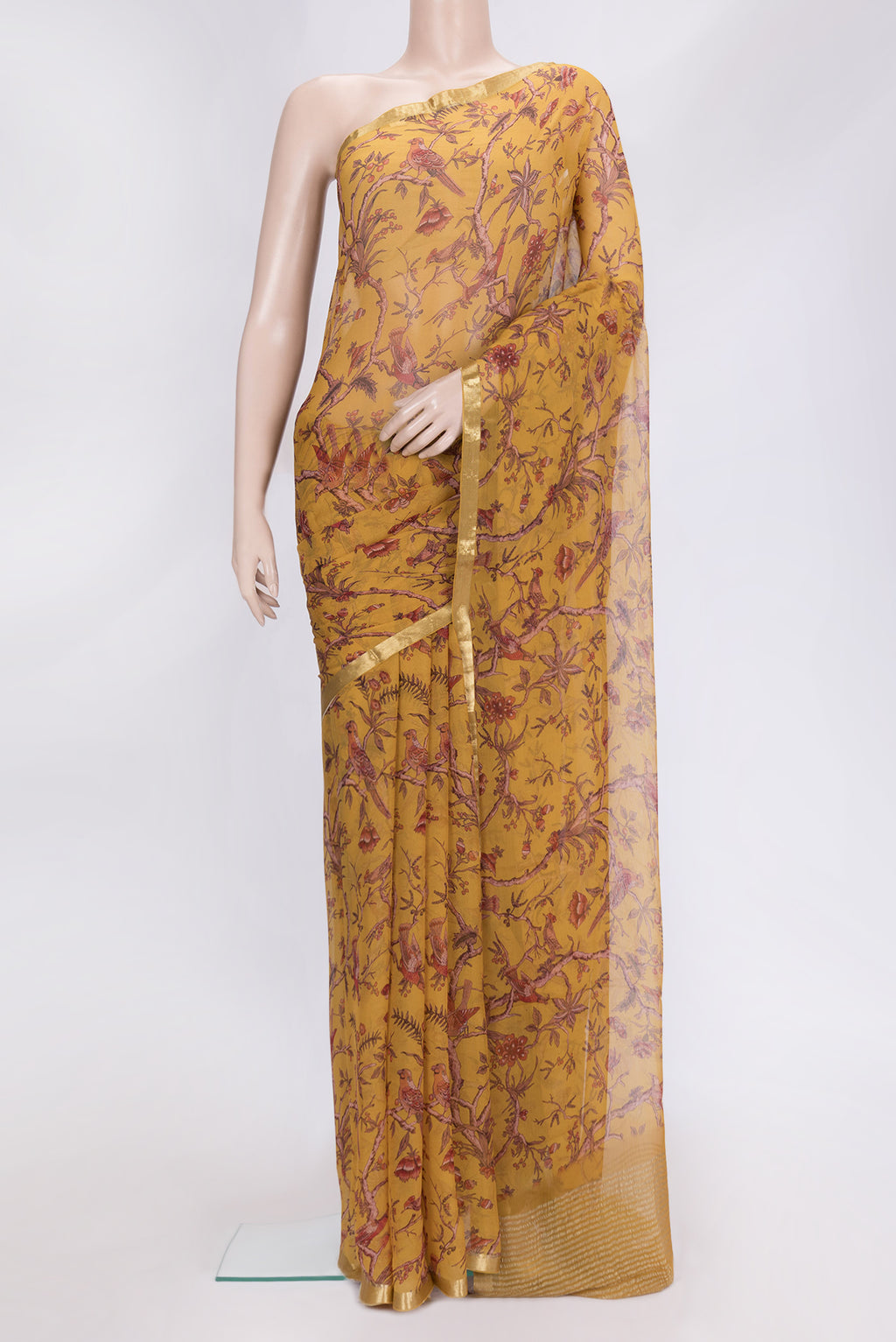 Mustard Dual Tone Mysore Chiffon Saree with Printed design on the body and Zari Border.  displayed on a mannequin