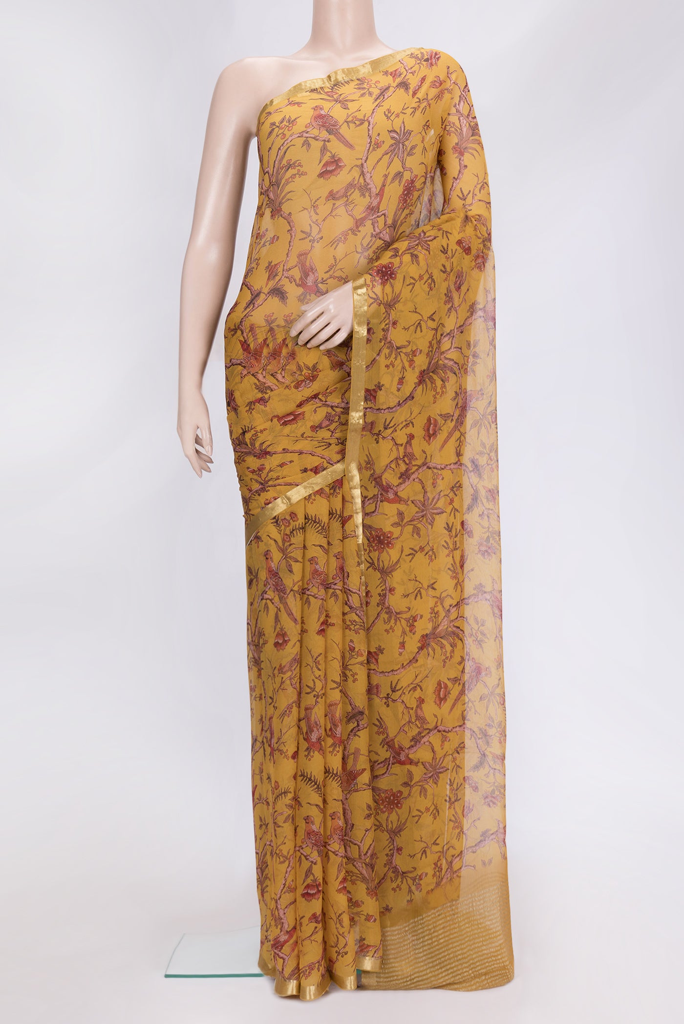 Mustard Dual Tone Mysore Chiffon Saree with Printed design on the body and Zari Border.  displayed on a mannequin