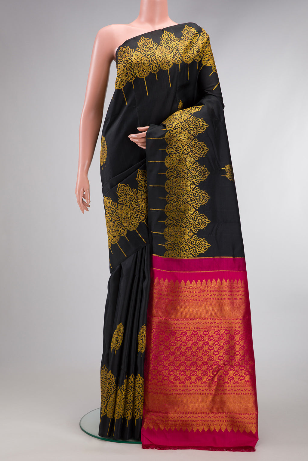 Black Dual Tone Kanjivaram Silk Saree with Zari Butta on the body and Fancy Border.  displayed on a mannequin