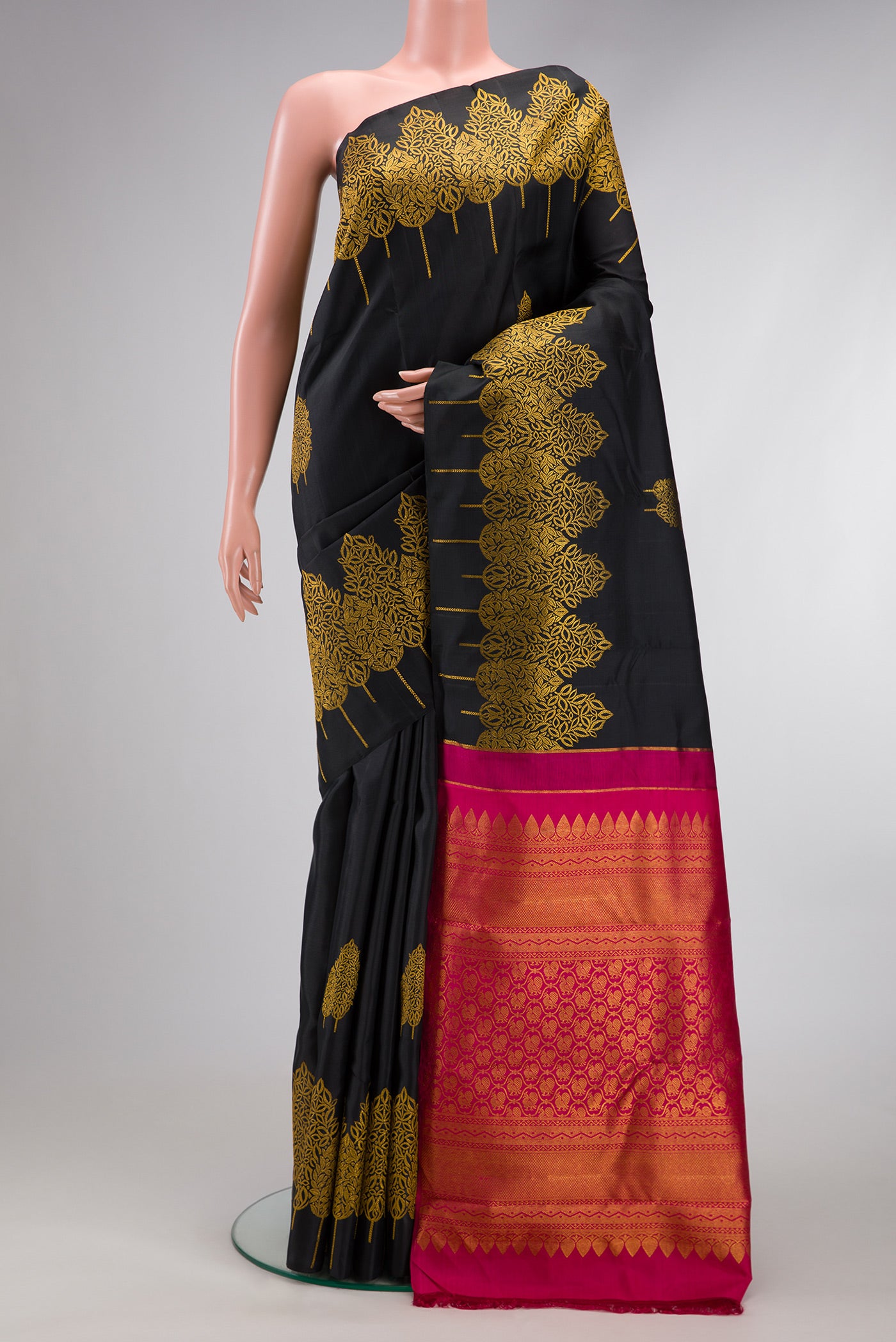 Black Dual Tone Kanjivaram Silk Saree with Zari Butta on the body and Fancy Border.  displayed on a mannequin