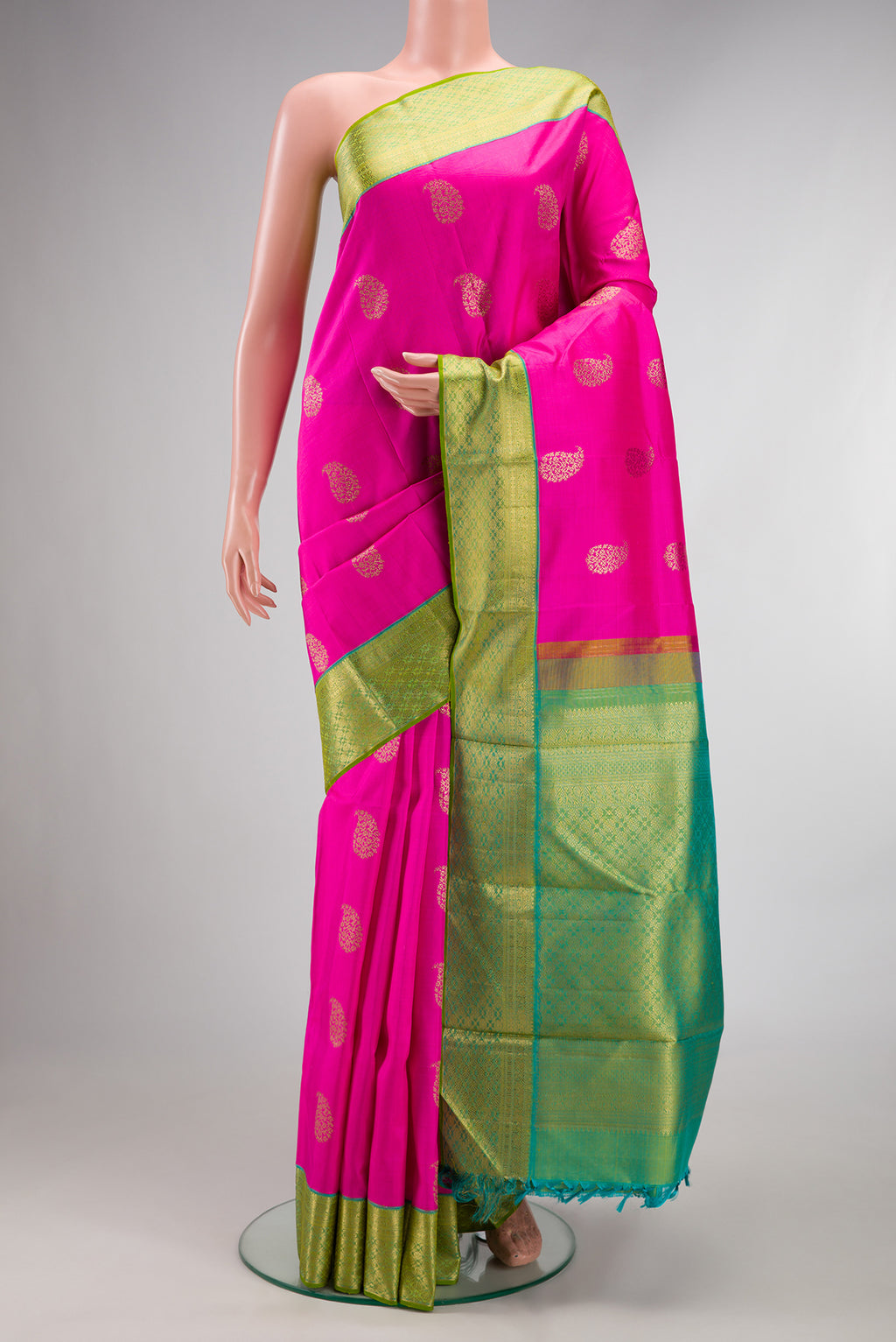 Pure Silk Pure Zari Pink Kanjivaram Saree with Zari Butta on the body and Zari Border.  displayed on a mannequin
