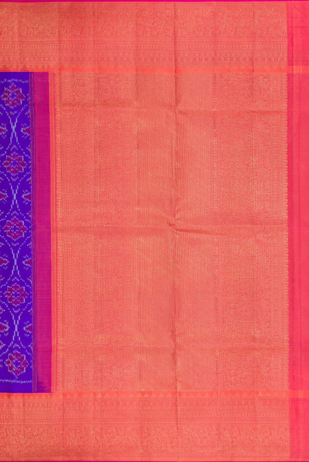 Close up image of the pallu of Orange Dual Tone Double Ikat Saree with Ikat Print on the body and Ikat Border. 