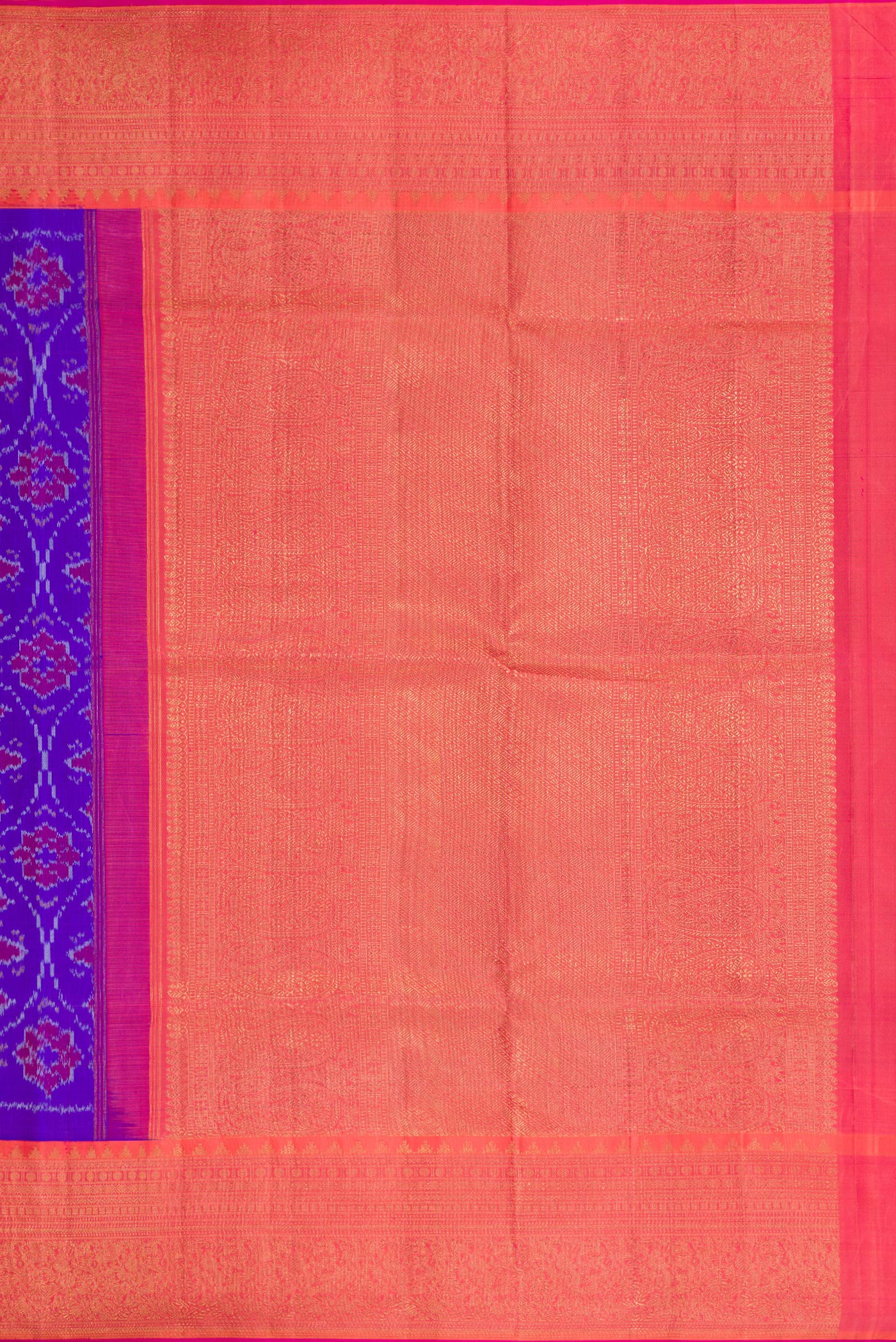 Close up image of the pallu of Orange Dual Tone Double Ikat Saree with Ikat Print on the body and Ikat Border. 