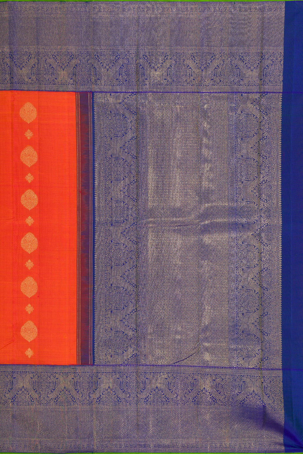 Close up image of the pallu of Pure Silk Pure Zari Orange Kanjivaram Saree with Zari Butta on the body and Fancy Border. 