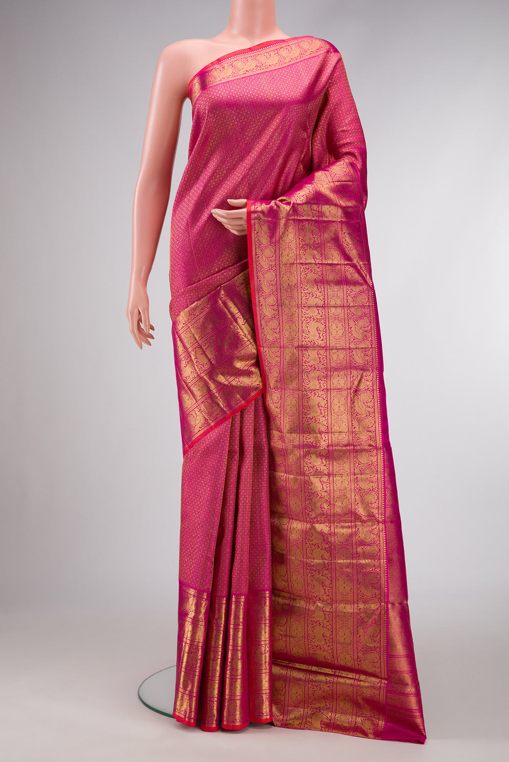 Pure Silk Pure Zari Magenta Dual Tone Kanjivaram Saree with Zari Brocade on the body and Zari Border.  displayed on a mannequin