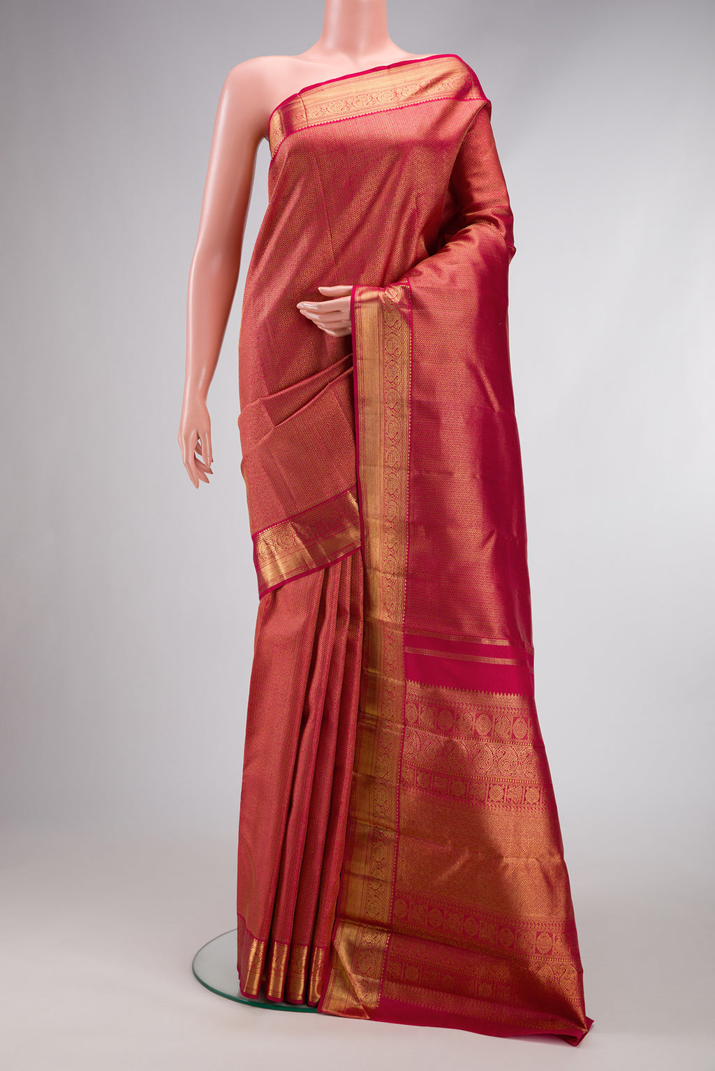 Pure Silk Pure Zari Maroon Dual Tone Kanjivaram Saree with Zari Brocade on the body and Zari Border.  displayed on a mannequin
