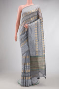 Grey Dual Tone Tussar Silk Saree with Zari Butta on the body and Embroidery Border.  displayed on a mannequin