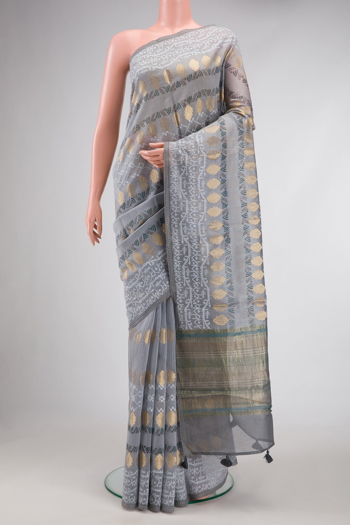 Grey Dual Tone Tussar Silk Saree with Zari Butta on the body and Embroidery Border.  displayed on a mannequin
