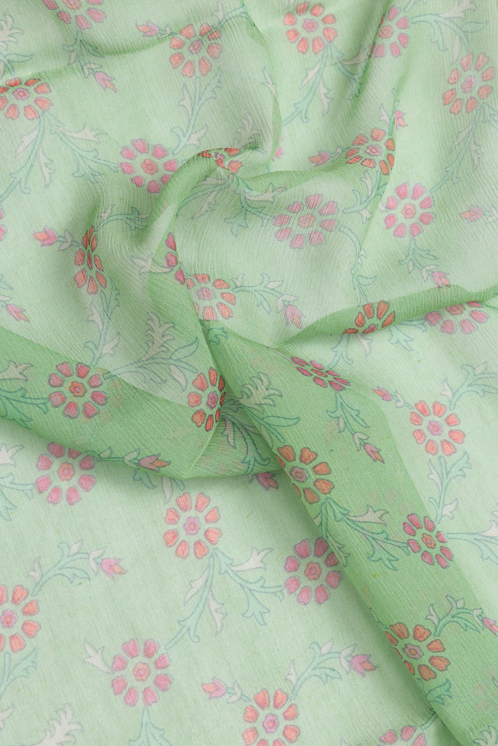 Close up of Green Dual Tone Mysore Chiffon Saree with Printed design on the body and Zari Border.  displaying folds