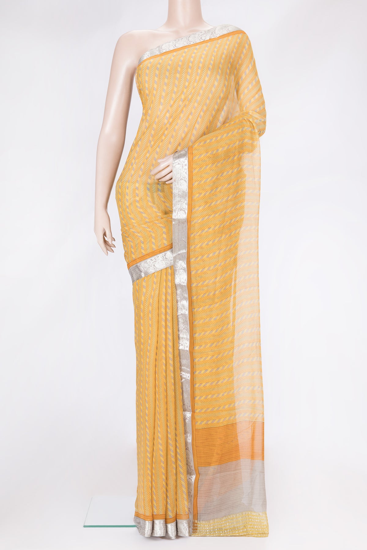 Yellow Dual Tone Mysore Georgette Saree with Printed design on the body and Zari Border.  displayed on a mannequin