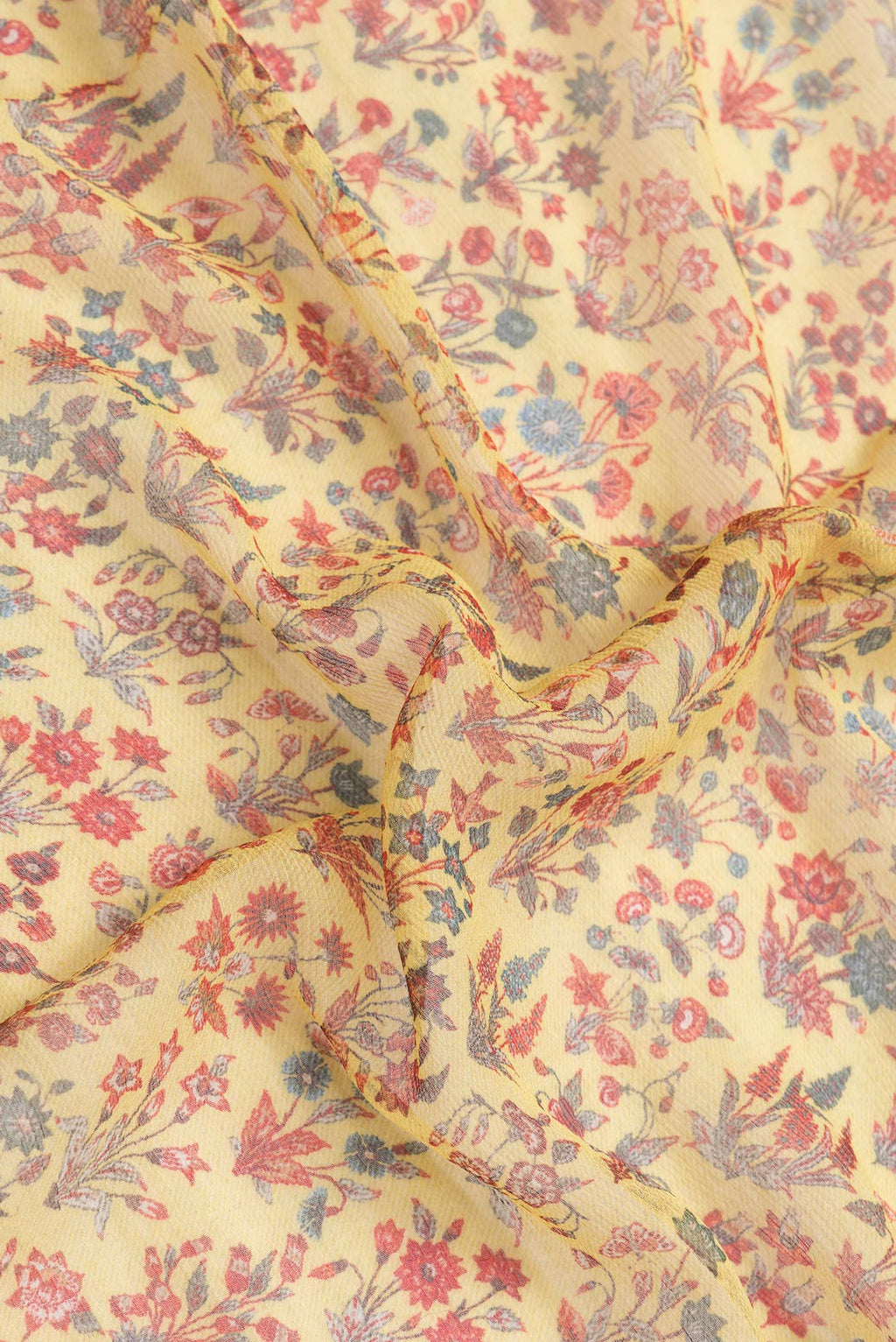 Close up of Yellow Dual Tone Mysore Chiffon Saree with Printed design on the body and Zari Border.  displaying folds