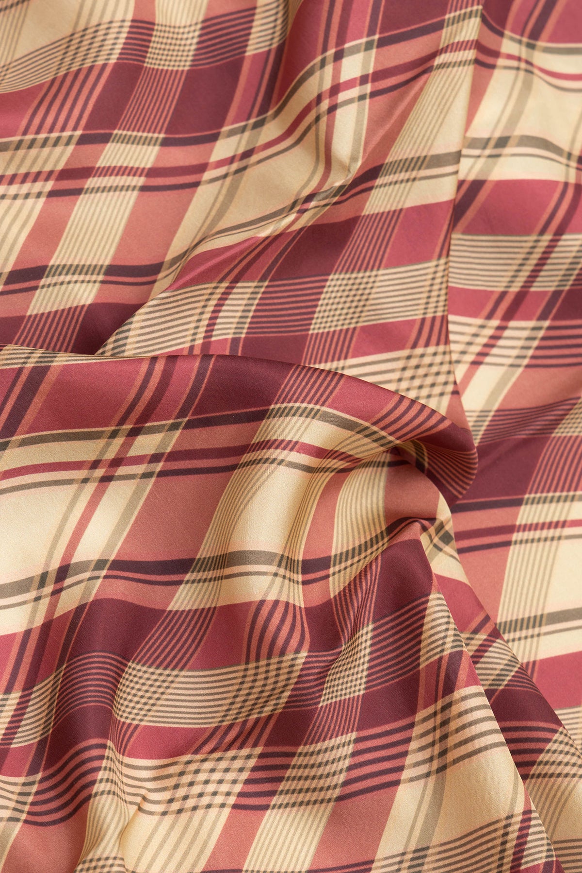 Close up of Beige Dual Tone Printed Silk Saree with Printed design on the body and Plain Border.  displaying folds
