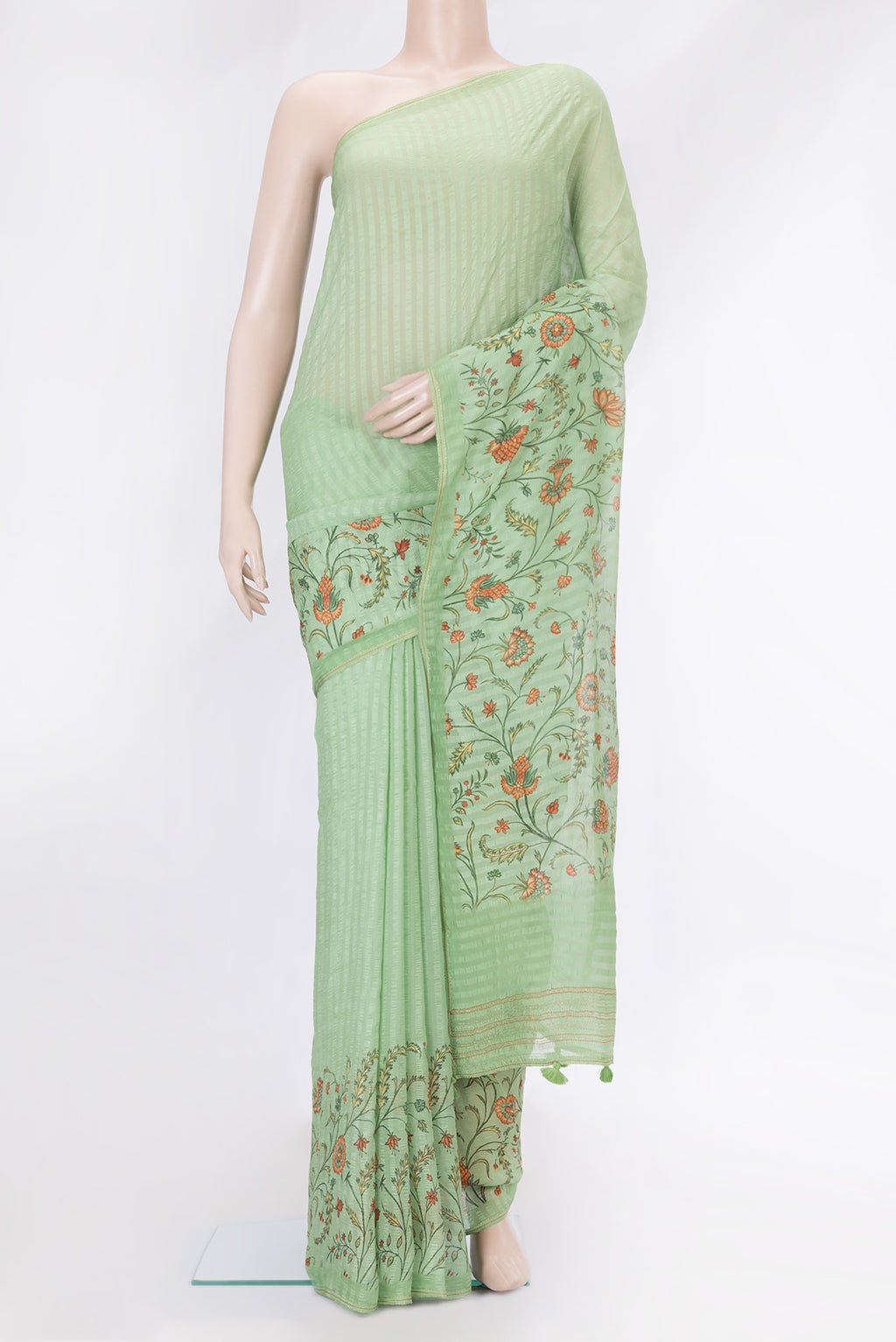 Pista Green Dual Tone Mysore Chiffon Saree with Printed design on the body and Zari Border.  displayed on a mannequin