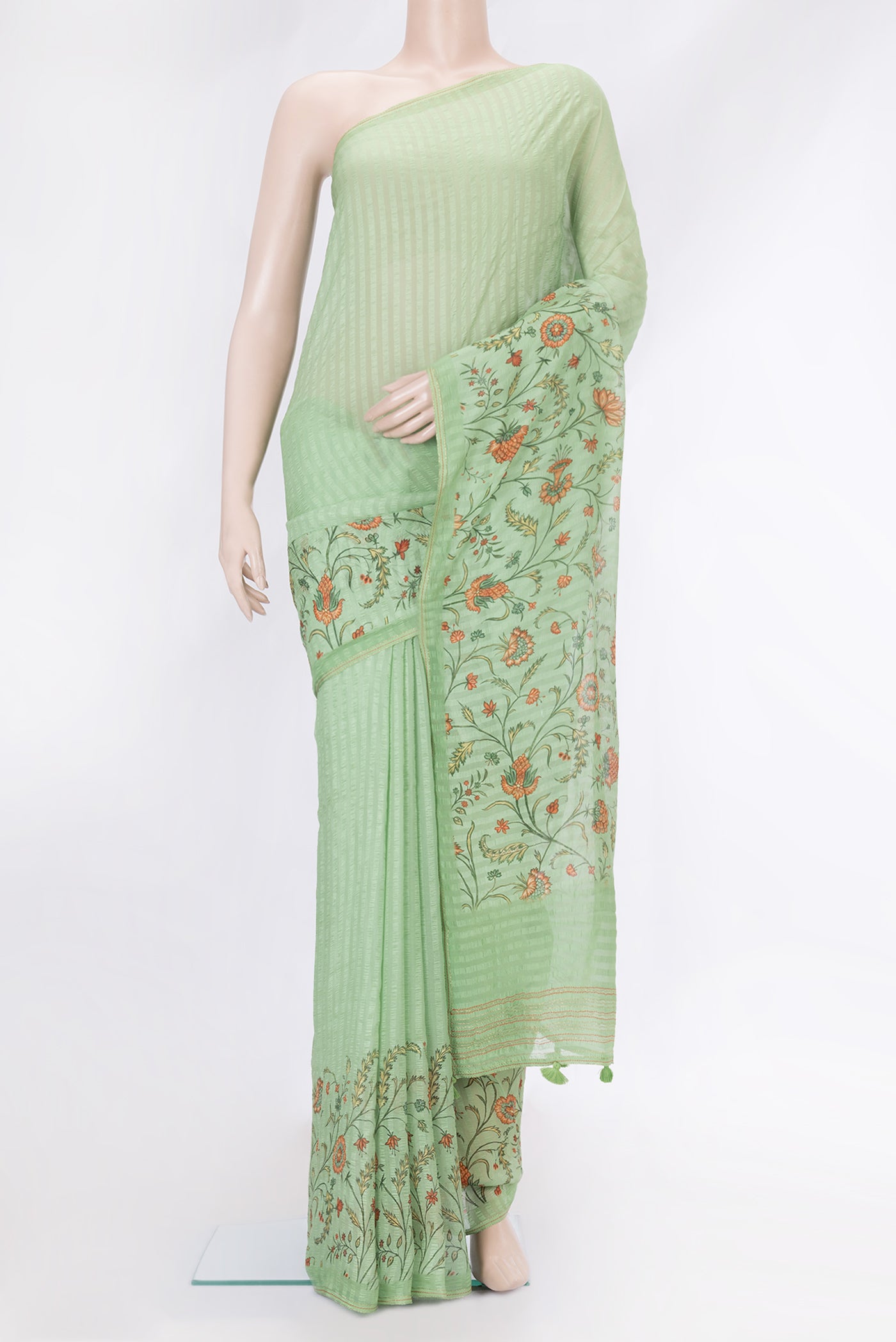 Pista Green Dual Tone Mysore Chiffon Saree with Printed design on the body and Zari Border.  displayed on a mannequin