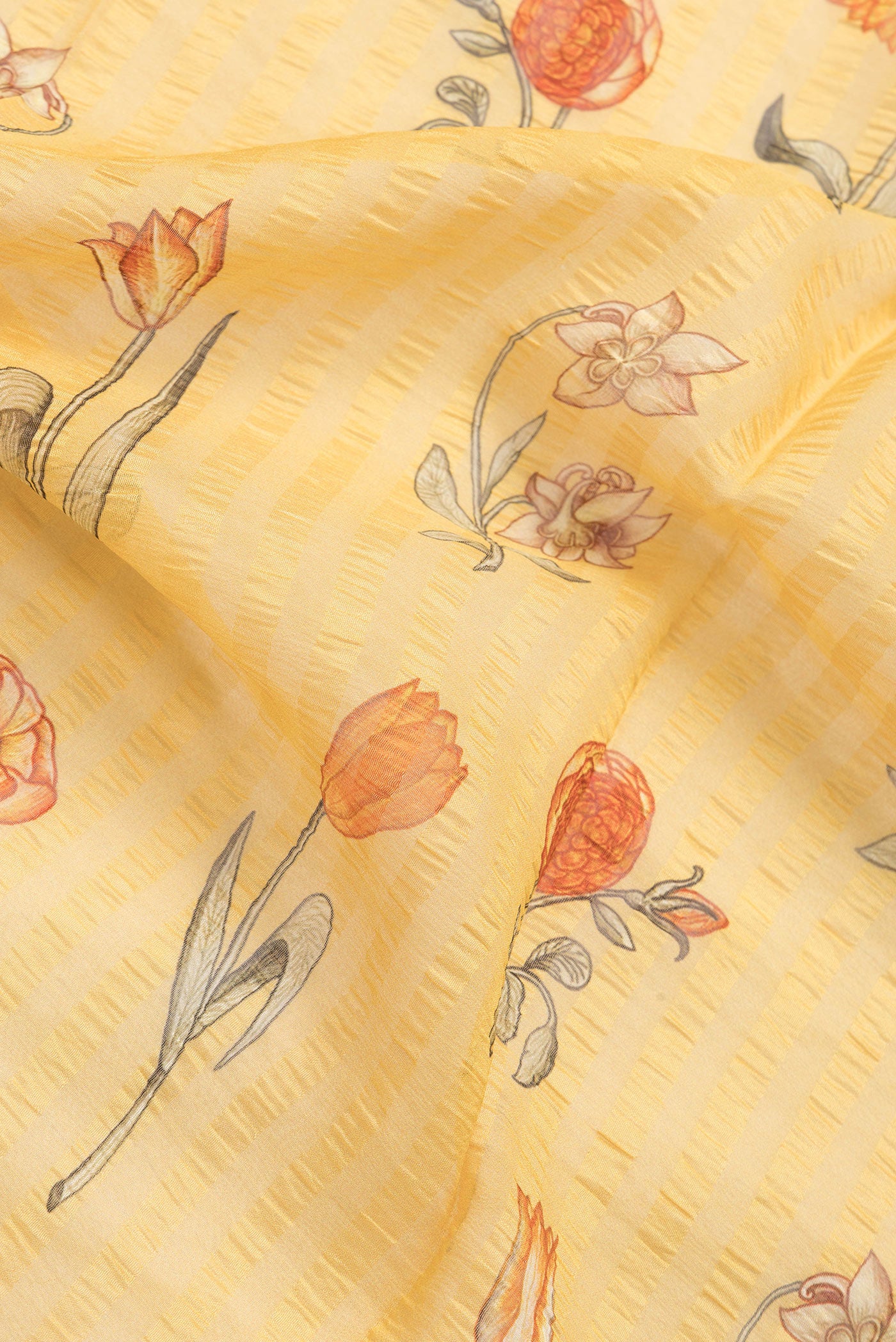 Close up of Yellow Dual Tone Mysore Georgette Saree with Printed design on the body and Zari Border.  displaying folds