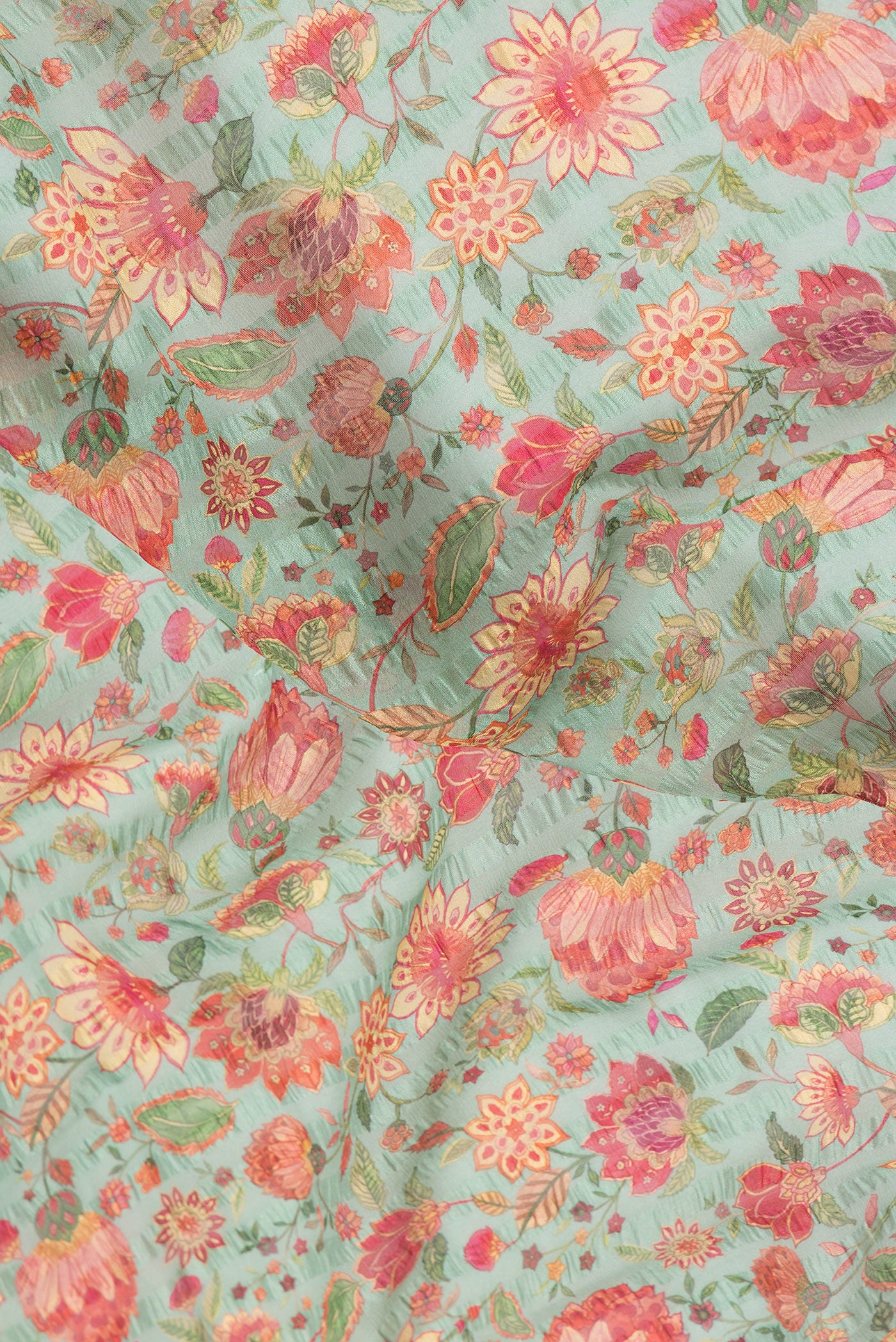 Close up of Green Dual Tone Mysore Georgette Saree with Printed design on the body and Plain Border.  displaying folds