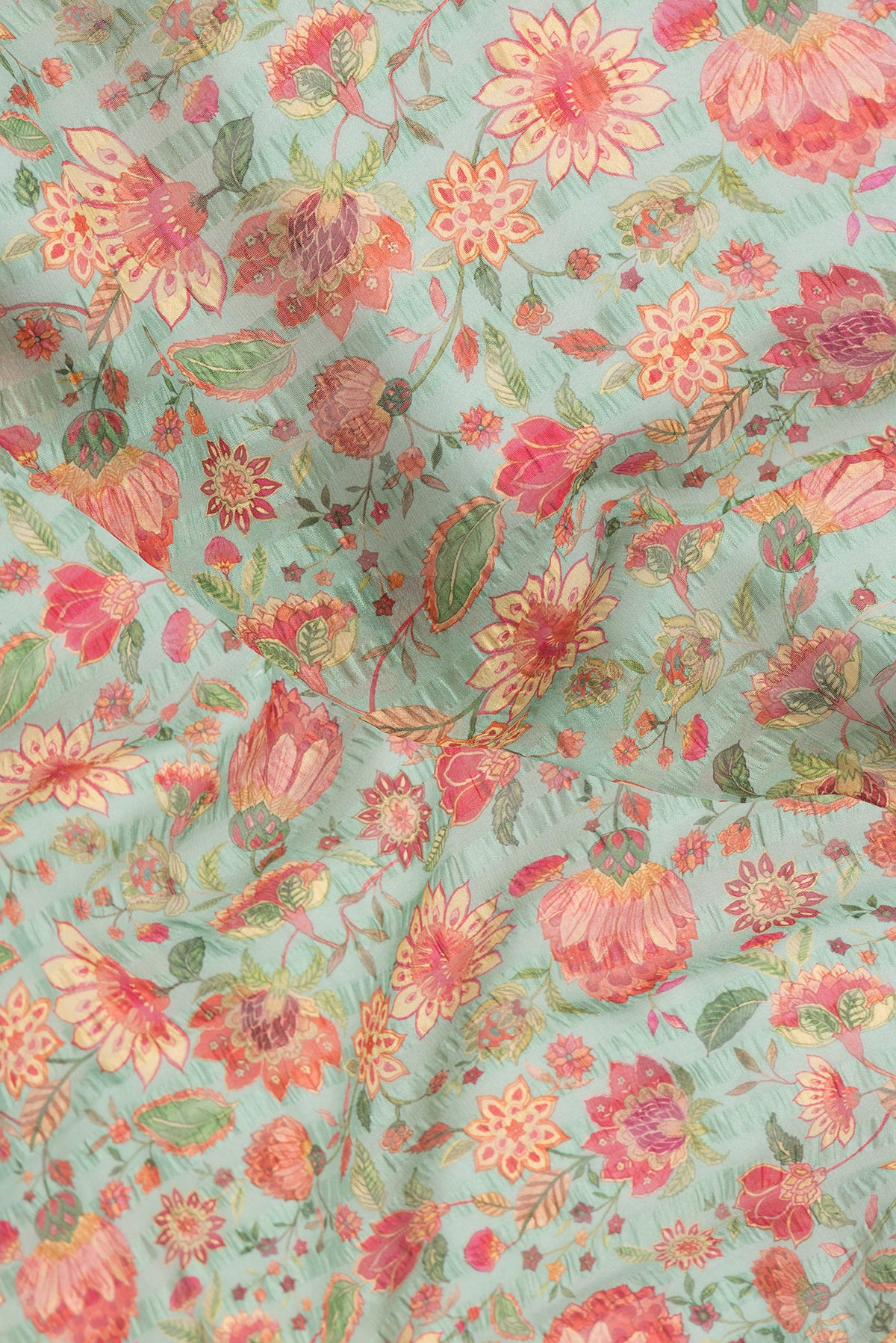 Close up of Green Dual Tone Mysore Georgette Saree with Printed design on the body and Plain Border.  displaying folds