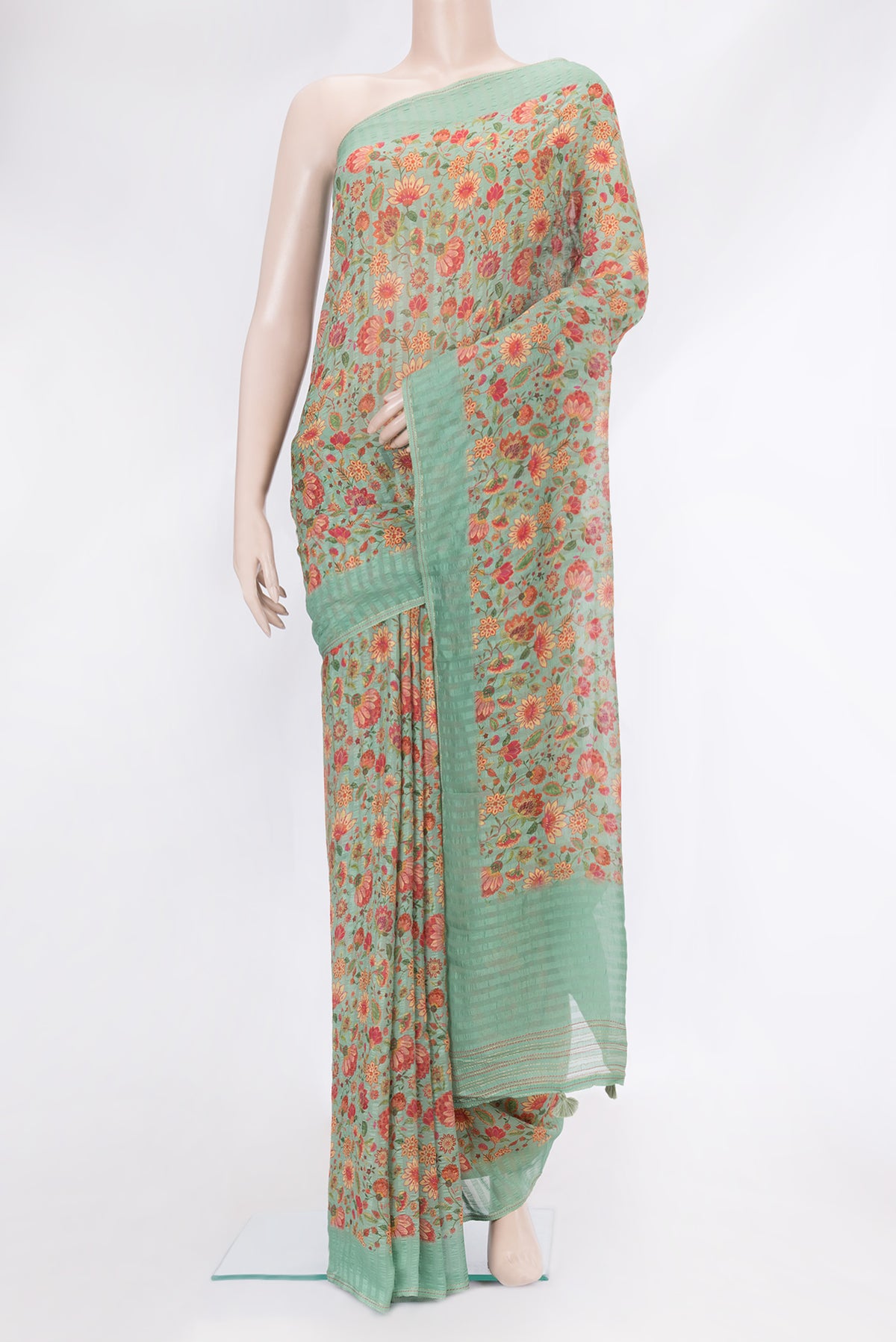 Green Dual Tone Mysore Georgette Saree with Printed design on the body and Plain Border.  displayed on a mannequin