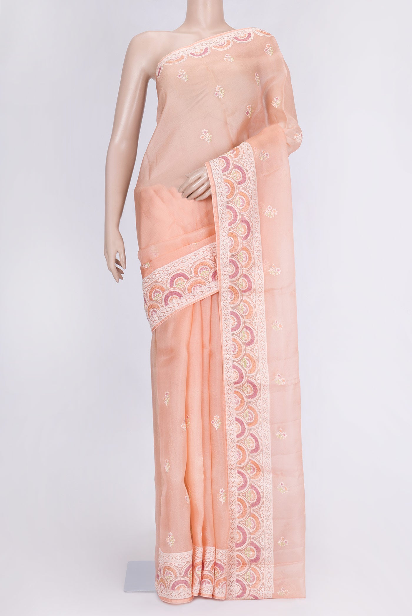 Peach Dual Tone Organza Silk Saree with Zari Butta on the body and Zari Border.  displayed on a mannequin