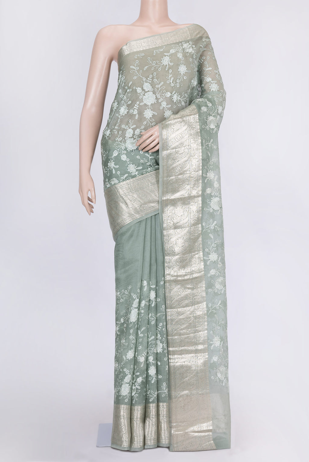 Light Green Dual Tone Organza Silk Saree with Zari Brocade on the body and Zari Border.  displayed on a mannequin