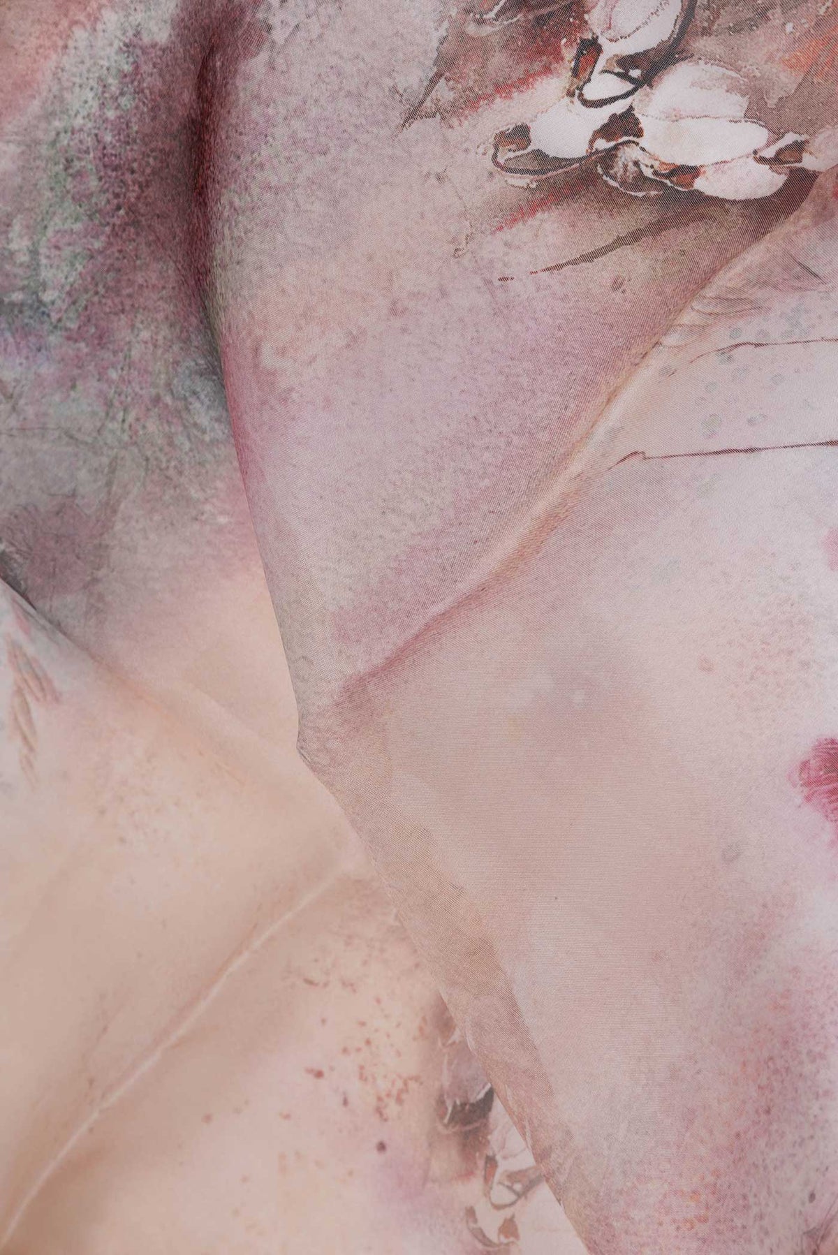 Close up of Pink Dual Tone Organza Silk Saree with Printed design on the body and Zari Border displaying folds