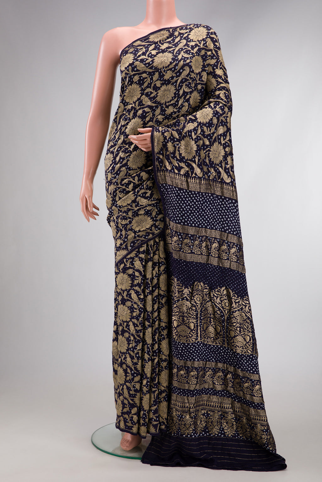 Navy Blue Dual Tone Bandhani Silk Saree with Bandhani Print on the body and Without Border.  displayed on a mannequin