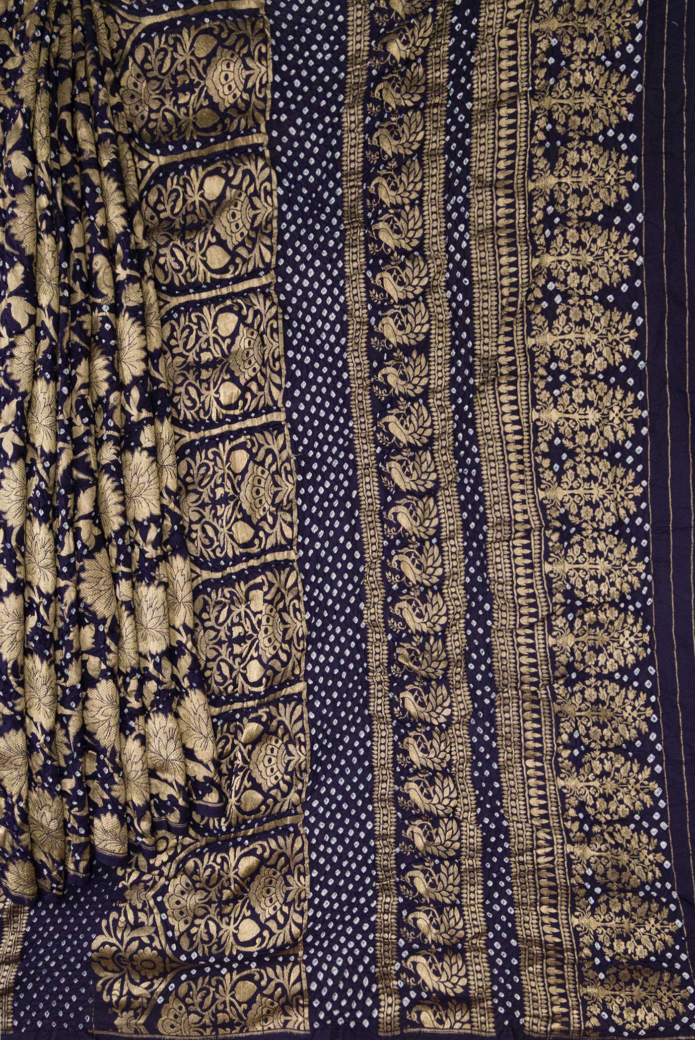 Pleats and pallu of Navy Blue Dual Tone Bandhani Silk Saree with Bandhani Print on the body and Without Border. 
