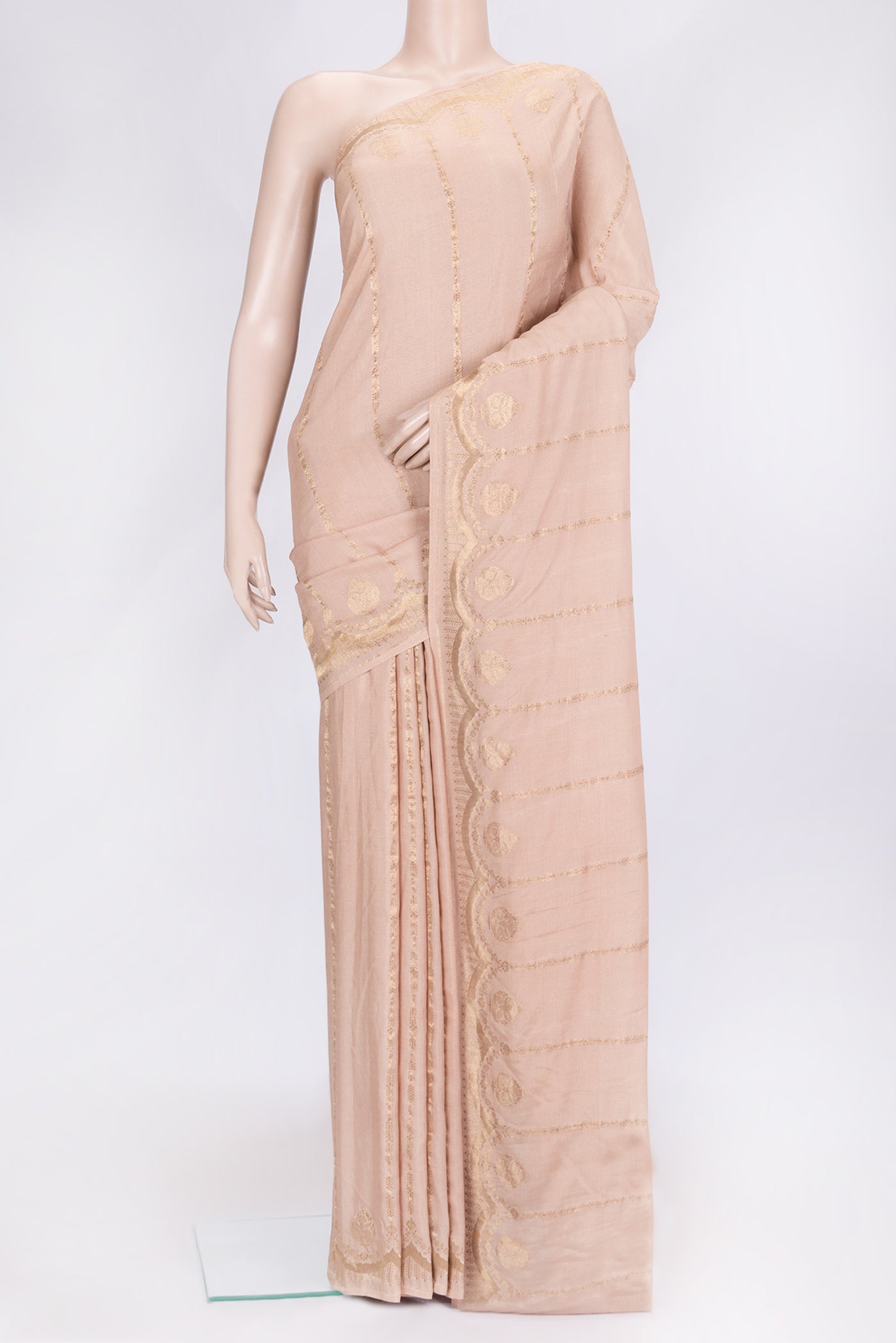 Beige Dual Tone Tussar Silk Saree with Stripes on the body and Fancy Border.  displayed on a mannequin