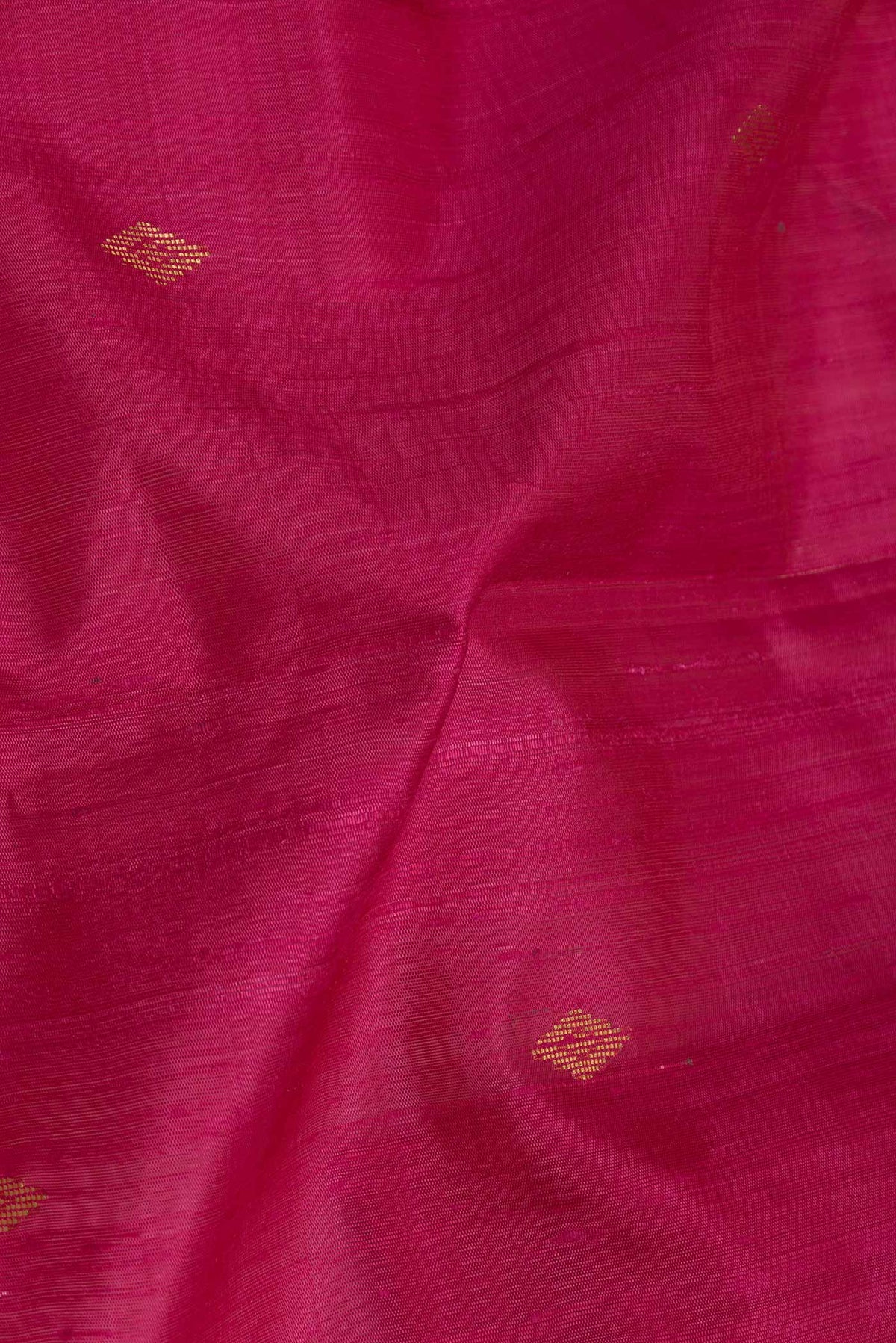 Close up of Pink Dual Tone Tussar Silk Saree with Zari Butta on the body and Zari Border displaying folds