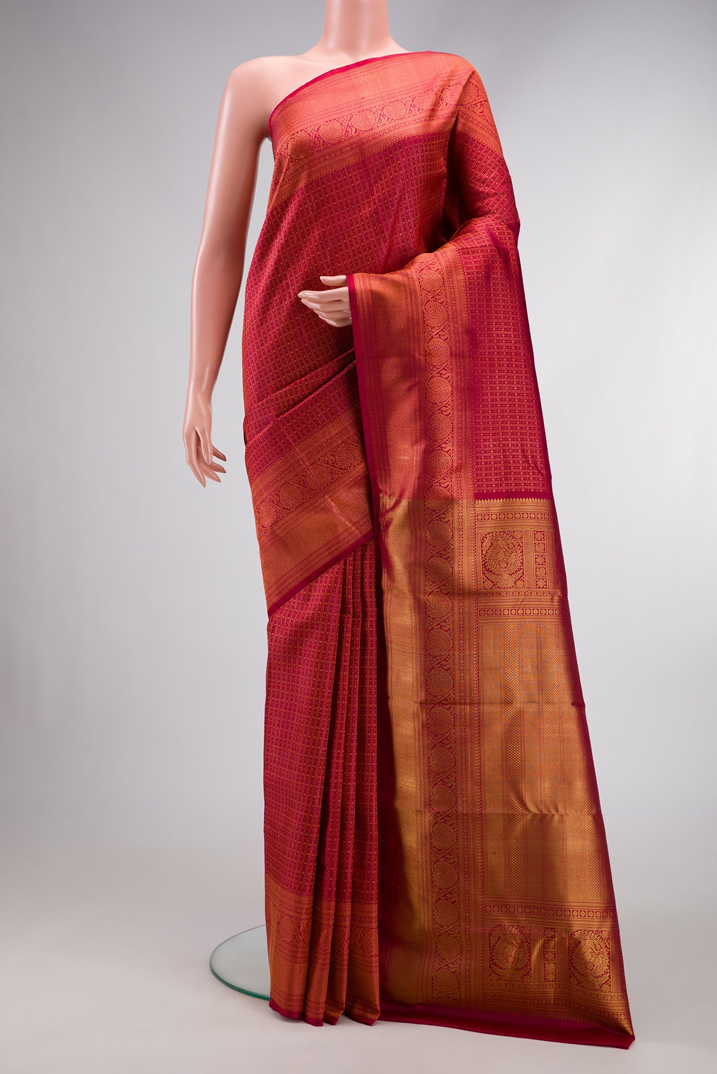 Maroon Dual Tone Kanchipuram Silk Saree with Zari Brocade on the body and Zari Border.  displayed on a mannequin
