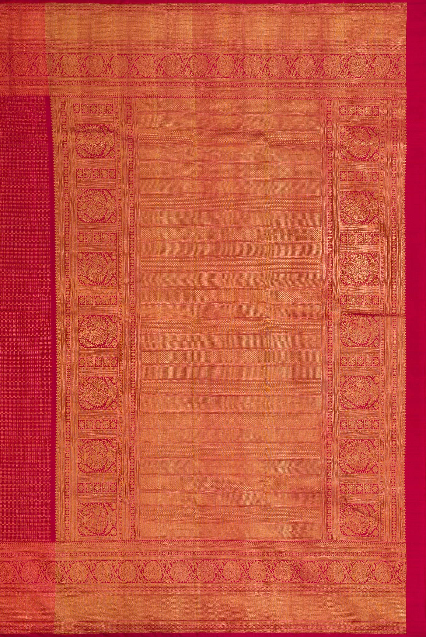 Close up image of the pallu of Maroon Dual Tone Kanchipuram Silk Saree with Zari Brocade on the body and Zari Border. 
