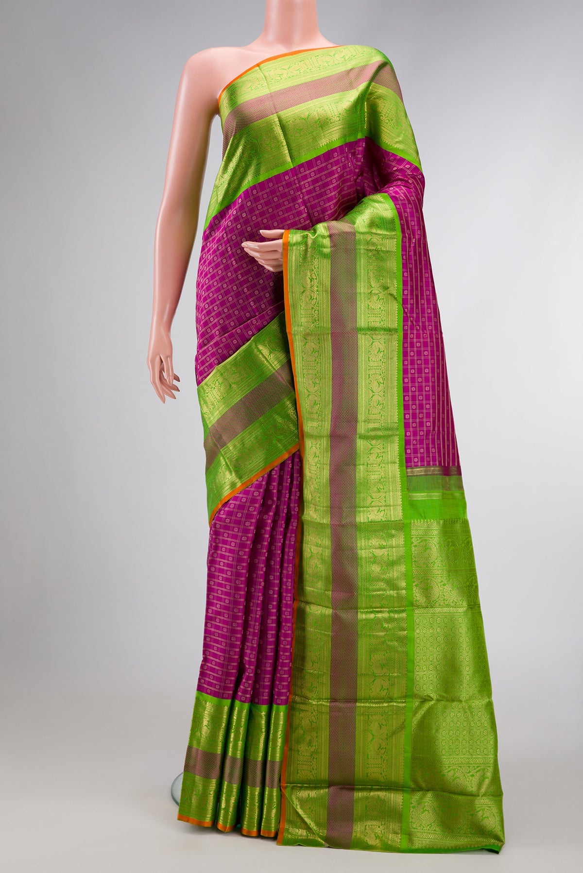 Pure Silk Pure Zari Magenta Dual Tone Kanjivaram Saree with Zari Brocade on the body and Zari Border.  displayed on a mannequin