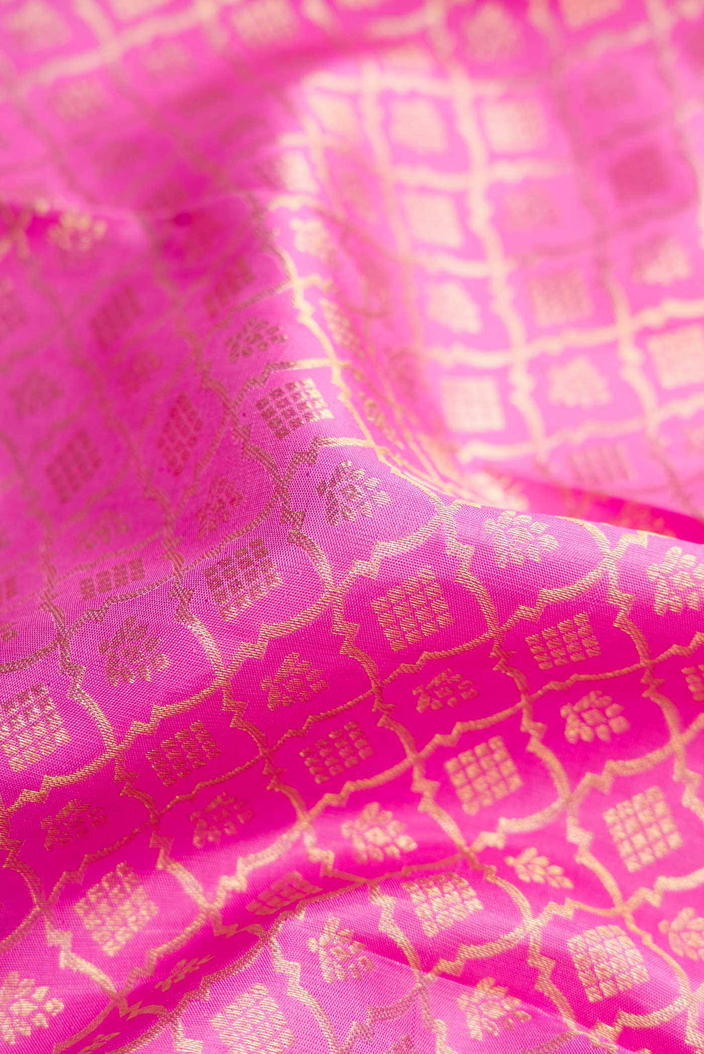 Close up of Pink Dual Tone Kanchipuram Silk Saree with Zari Brocade on the body and Zari Border displaying folds