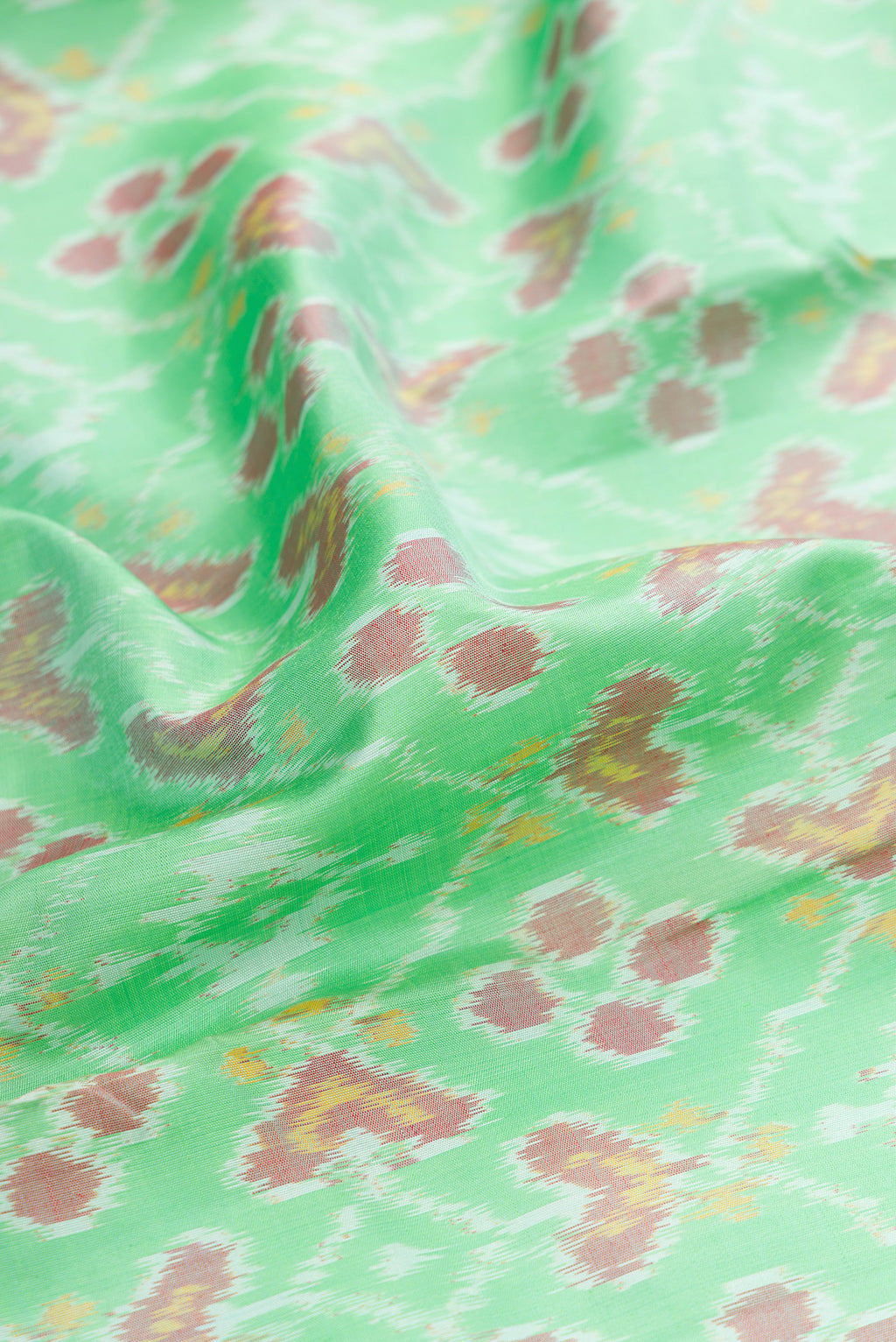 Close up of Mustard Dual Tone Tussar Silk Saree with Embroidery on the body and Embroidery Border.  displaying folds