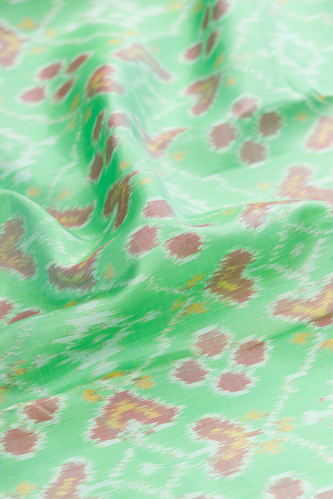Close up of Mustard Dual Tone Tussar Silk Saree with Embroidery on the body and Embroidery Border.  displaying folds
