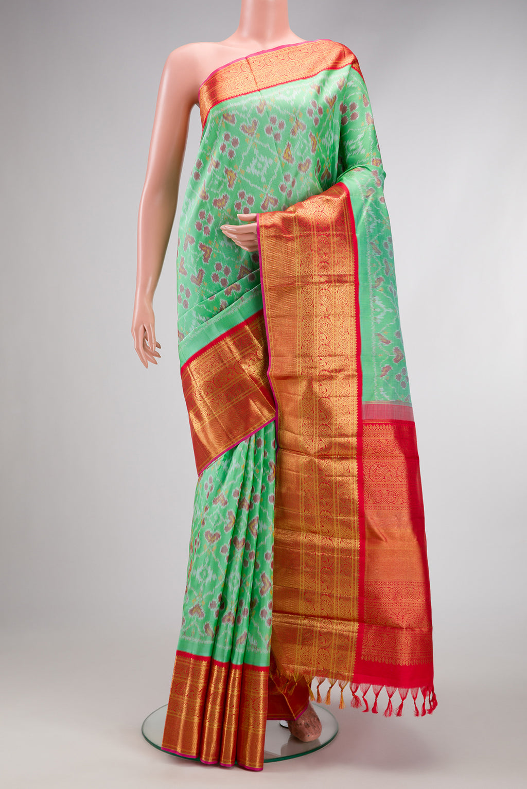 Mustard Dual Tone Tussar Silk Saree with Embroidery on the body and Embroidery Border.  displayed on a mannequin