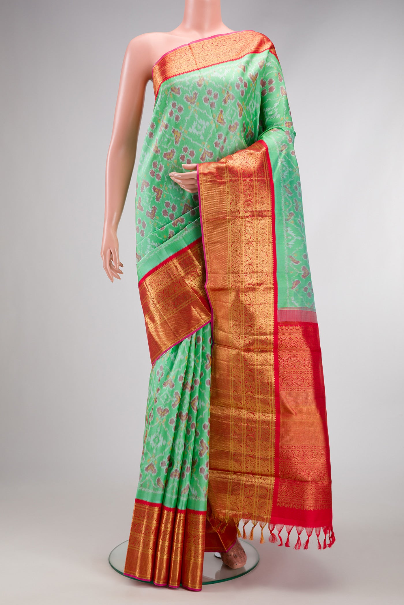 Mustard Dual Tone Tussar Silk Saree with Embroidery on the body and Embroidery Border.  displayed on a mannequin