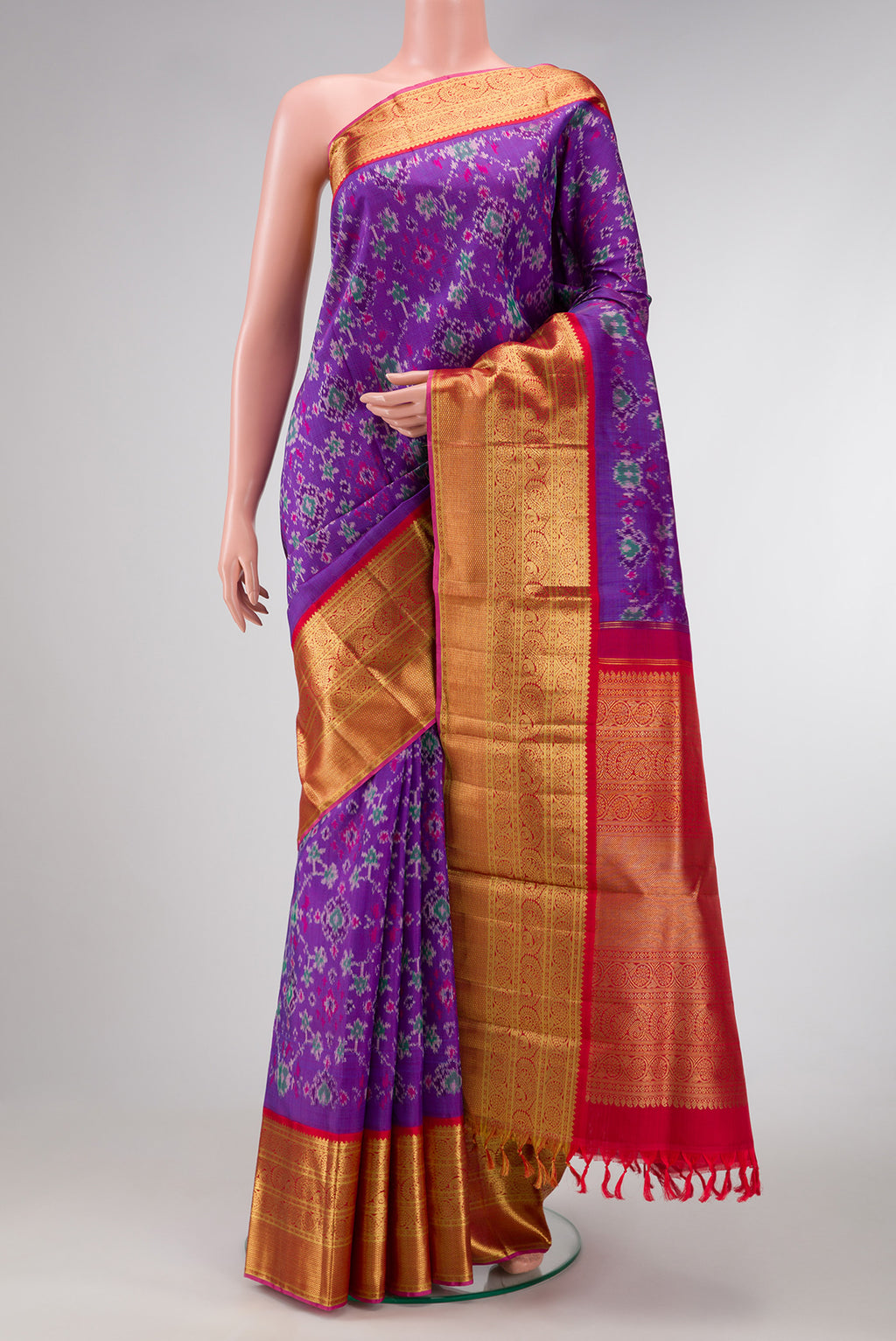 Purple Dual Tone Kanjivaram Silk Saree with Ikat Print on the body and Zari Border.  displayed on a mannequin