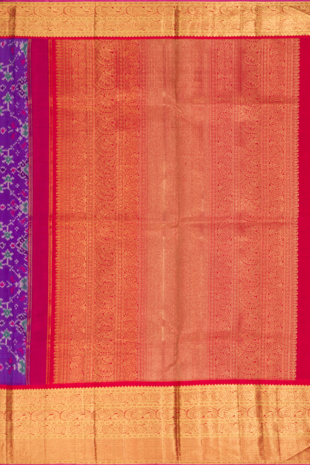 Close up image of the pallu of Purple Dual Tone Kanjivaram Silk Saree with Ikat Print on the body and Zari Border. 