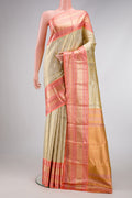Gold Dual Tone Kanjivaram Tissue Silk Saree with Zari Brocade on the body and Zari Border.  displayed on a mannequin