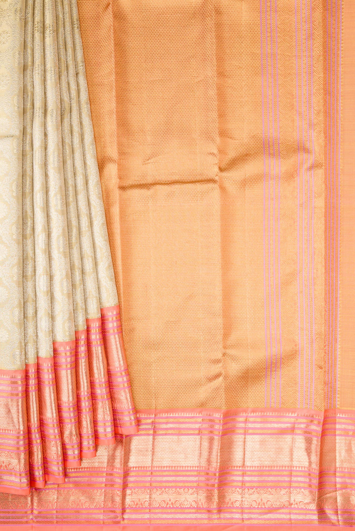 Pleats and pallu of Gold Dual Tone Kanjivaram Tissue Silk Saree with Zari Brocade on the body and Zari Border. 