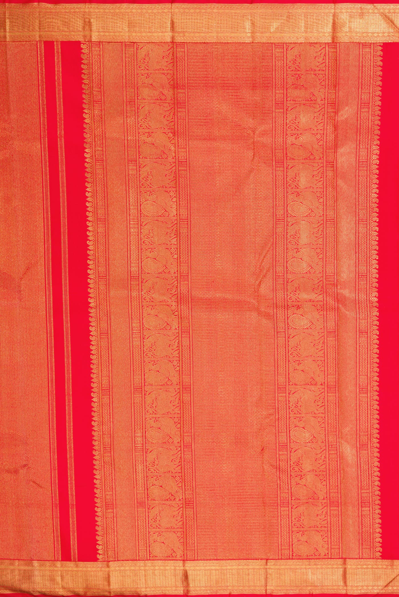 Close up image of the pallu of Pure Silk Pure Zari Red Dual Tone Kanjivaram Saree with Zari Brocade on the body and Zari Border. 