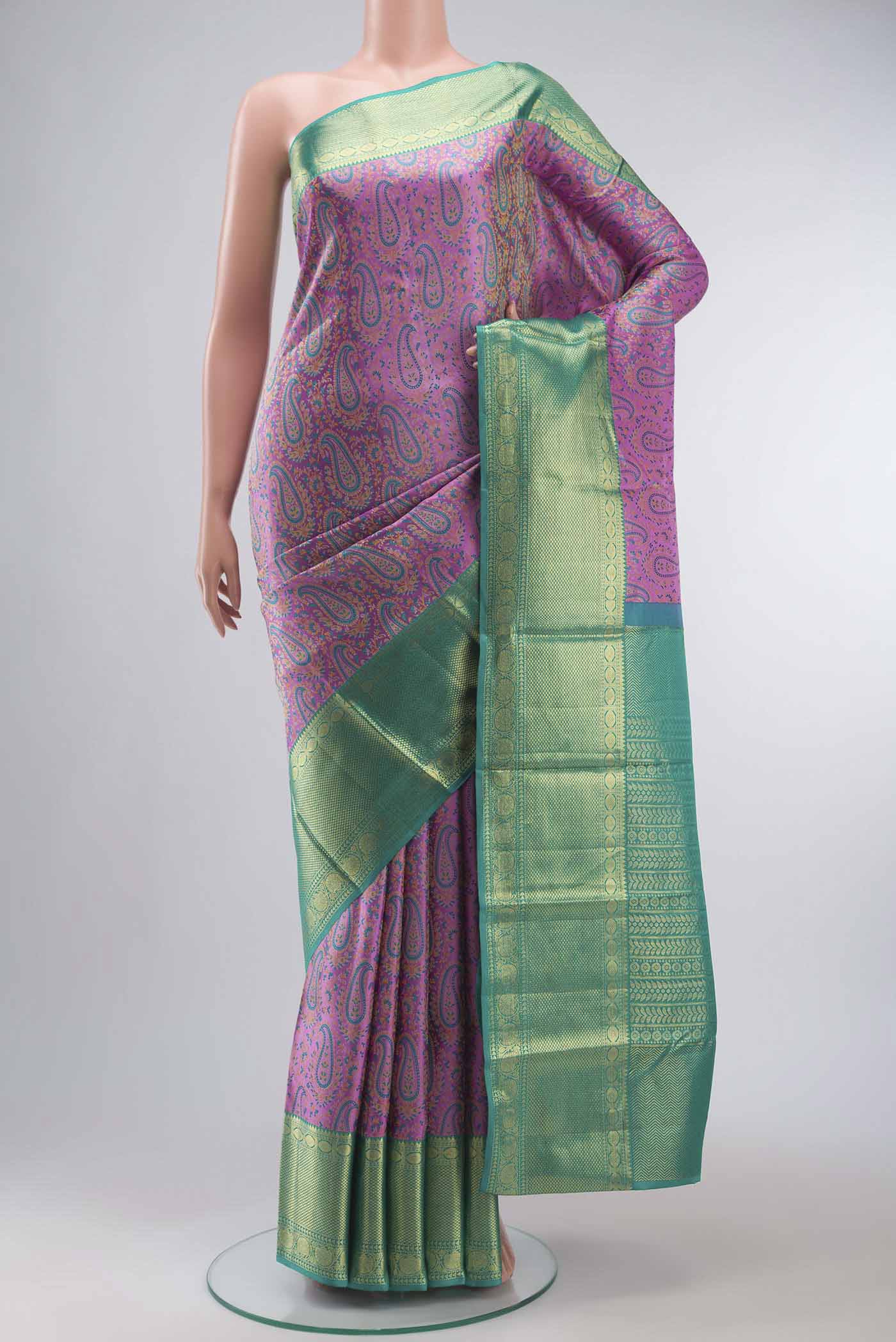 Lavender Kanchipuram Silk Saree with Jacquard design on the body and Zari Border displayed on a mannequin