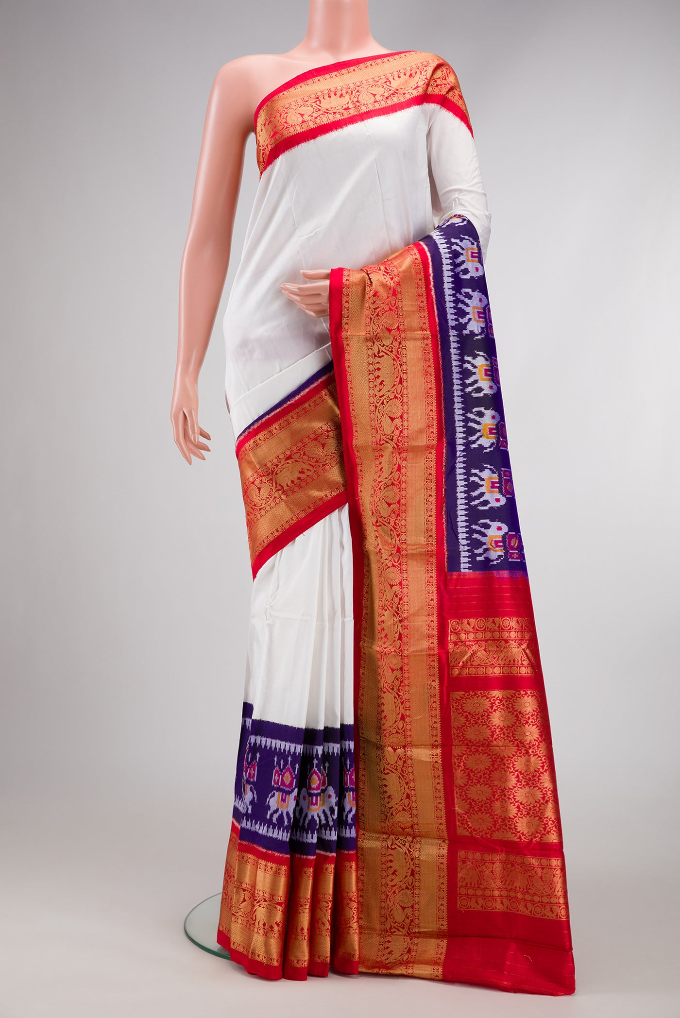 White Double Ikat Saree with Plain Body and Ganga Jamuna Border.  displayed on a mannequin