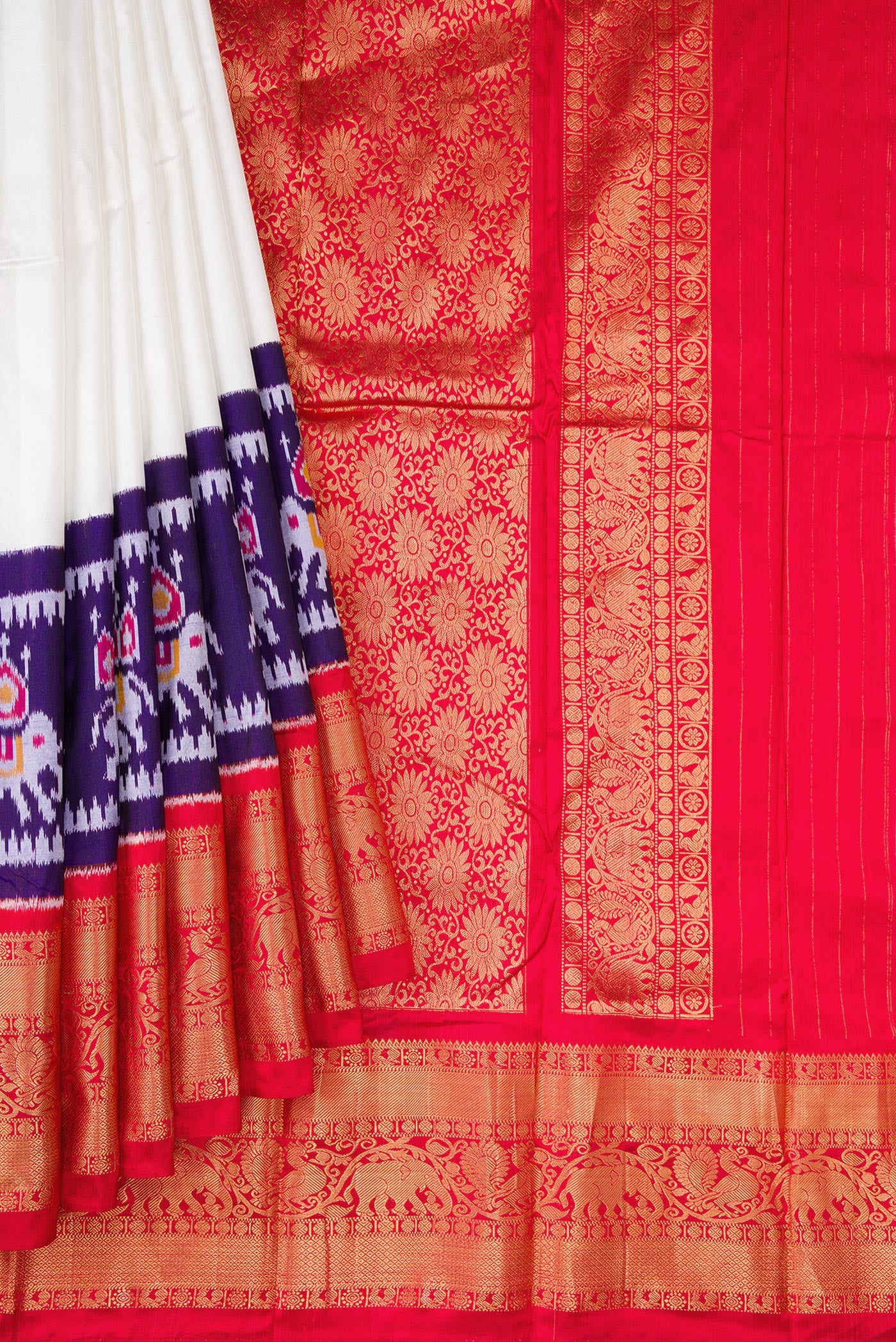 Pleats and pallu of White Double Ikat Saree with Plain Body and Ganga Jamuna Border. 