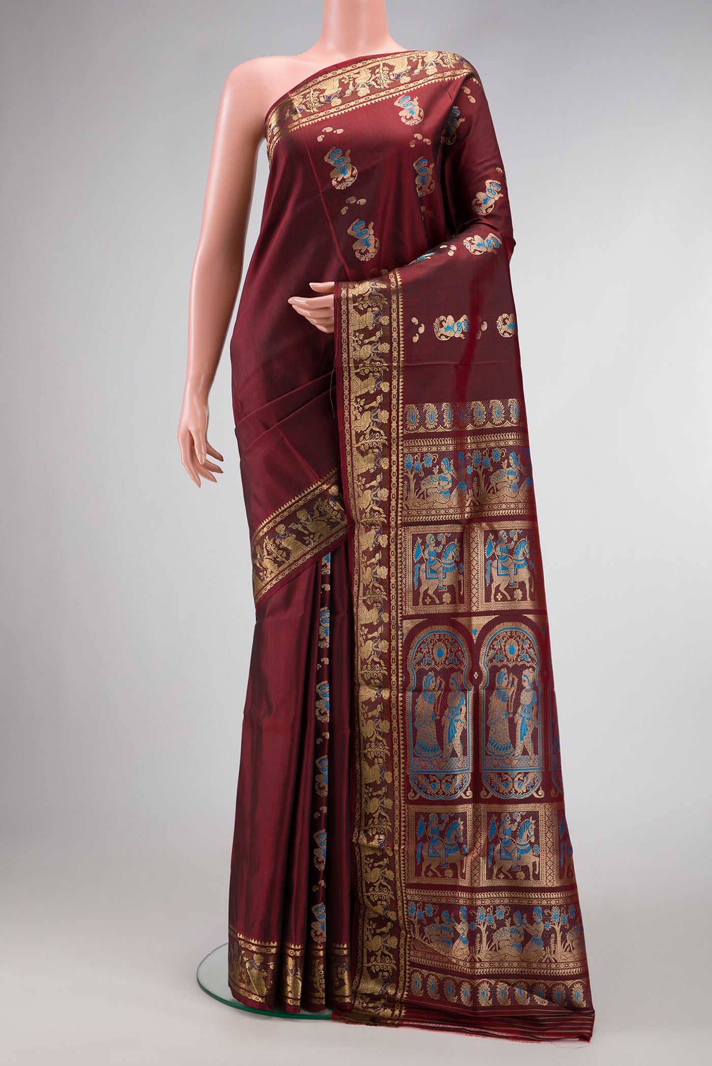 Maroon Dual Tone Baluchari Silk Saree with Thread Butta on the body and Thread Border.  displayed on a mannequin