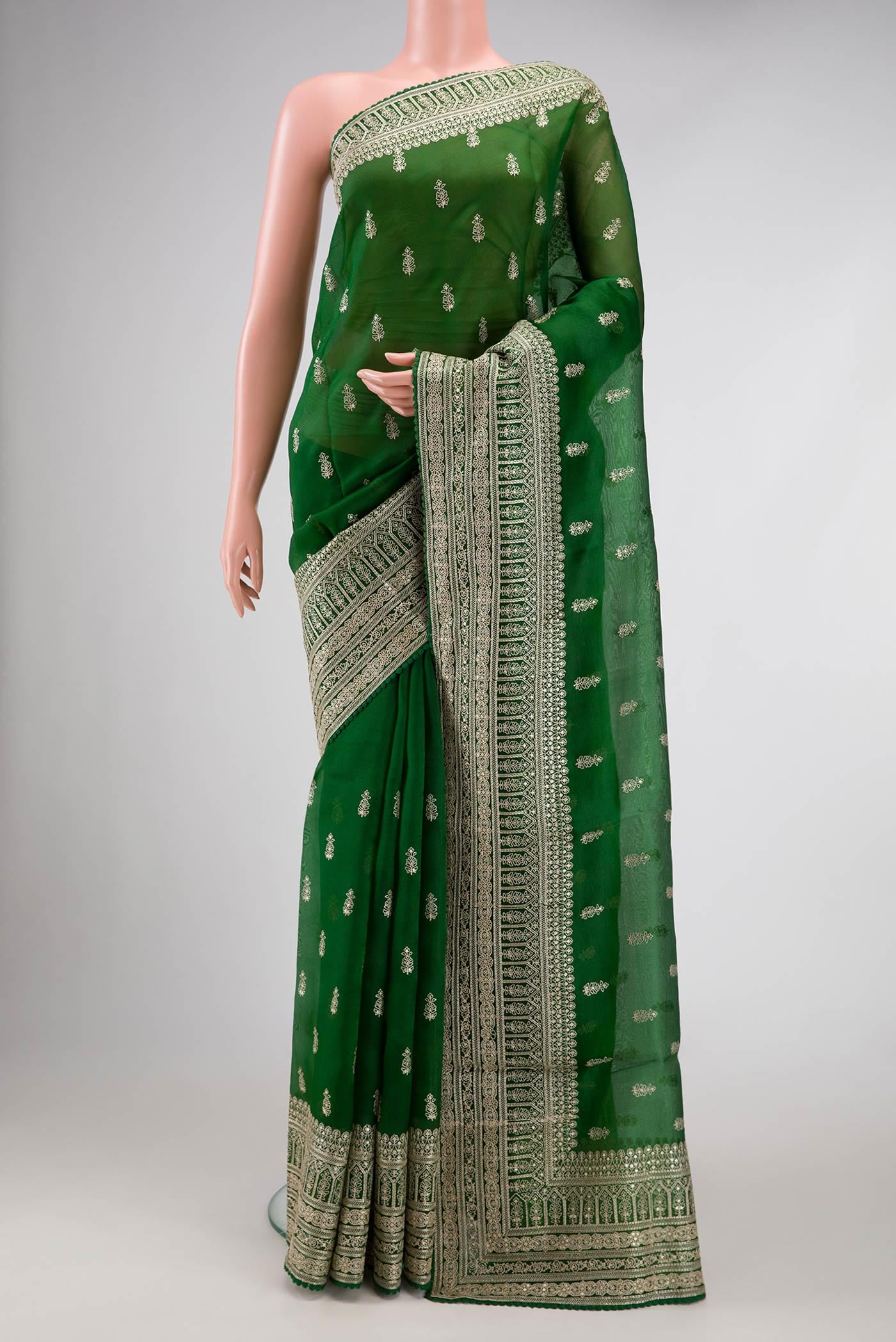 Bottle Green Dual Tone Organza Silk Saree with Embroidery on the body and Embroidery Border.  displayed on a mannequin