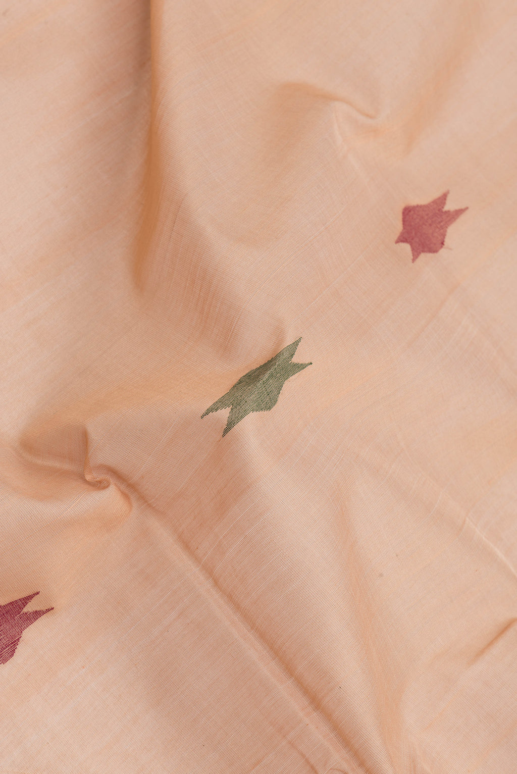 Close up of Sandal Dual Tone Uppada Cotton Saree with Zari And Thread Butta on the body and Zari Border.  displaying folds